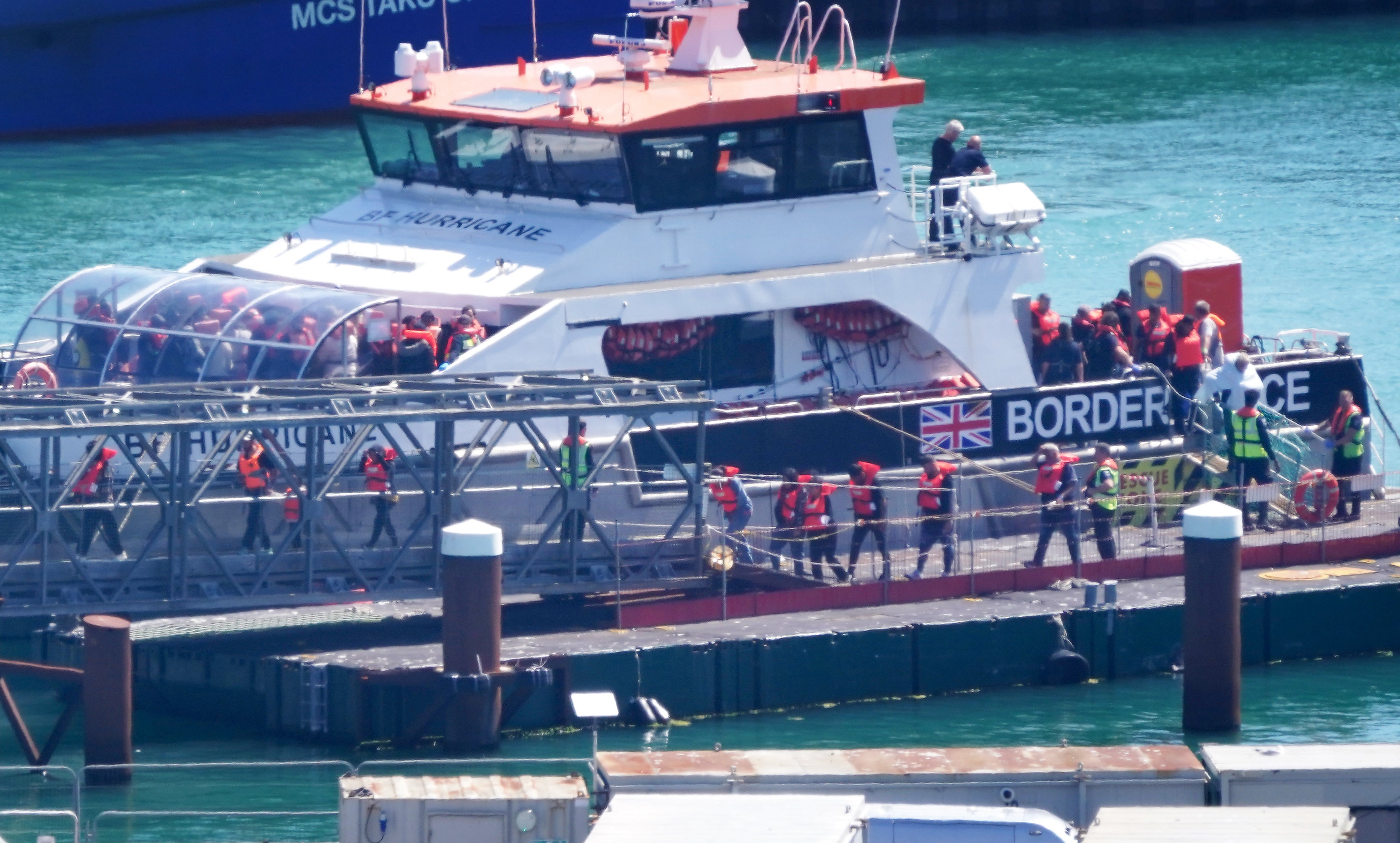 A group of people thought to be migrants are brought in to Dover, Kent, from a Border Force vessel following a small boat incident in the Channel.