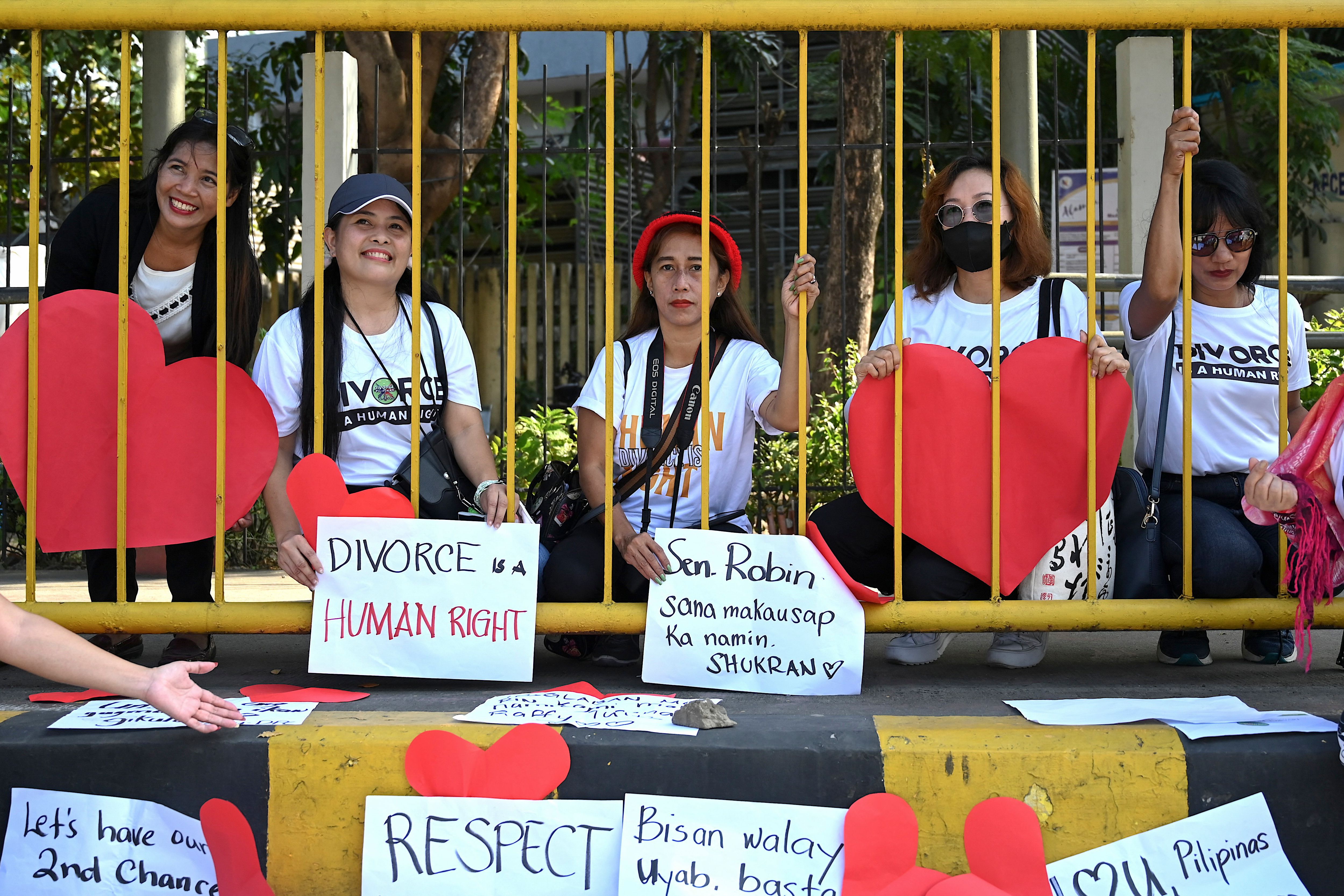 Pro-divorce protesters take part in a demonstration on Valentine’s Day last year in front of the Senate building in Pasay, Metro, Manila