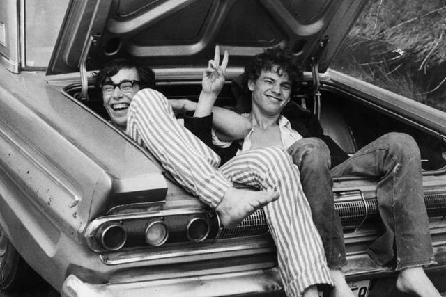 <p>Two young music fans hitch a lift home from Woodstock Music and Arts Fair, August 1969</p>