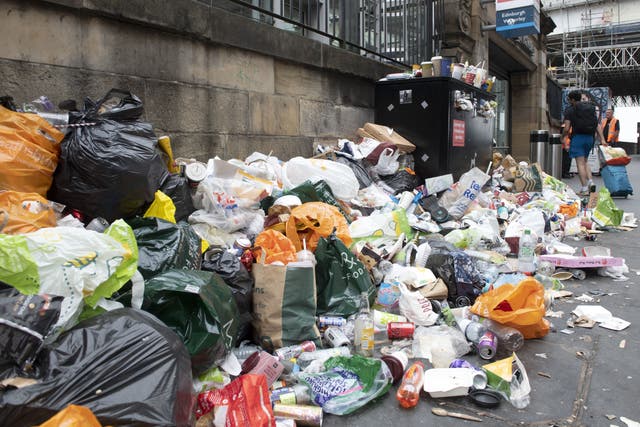 Strikes by cleansing workers in recent years have resulted in piles of rubbish in the street (Lesley Martin/PA)