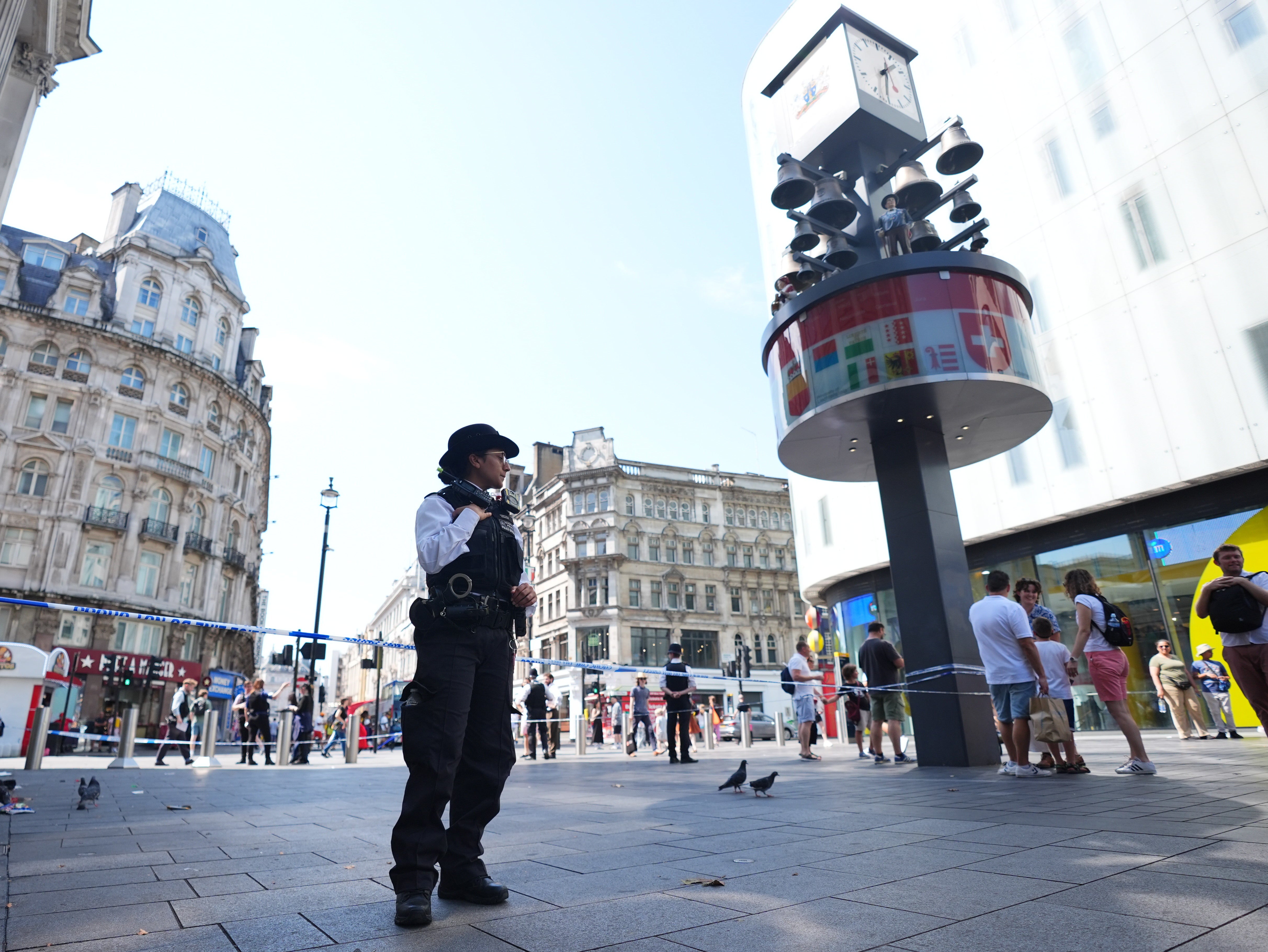 Police officers at the scene of the incident in Leicester Square on Monday