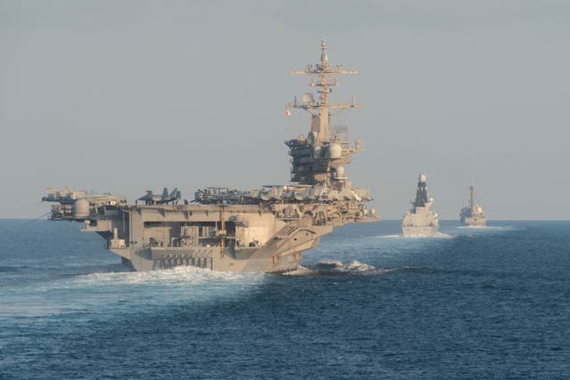 <p>The aircraft carrier USS Abraham Lincoln, pictured in 2019, is part of a ‘massive armada’ that has arrived in the Middle East</p>