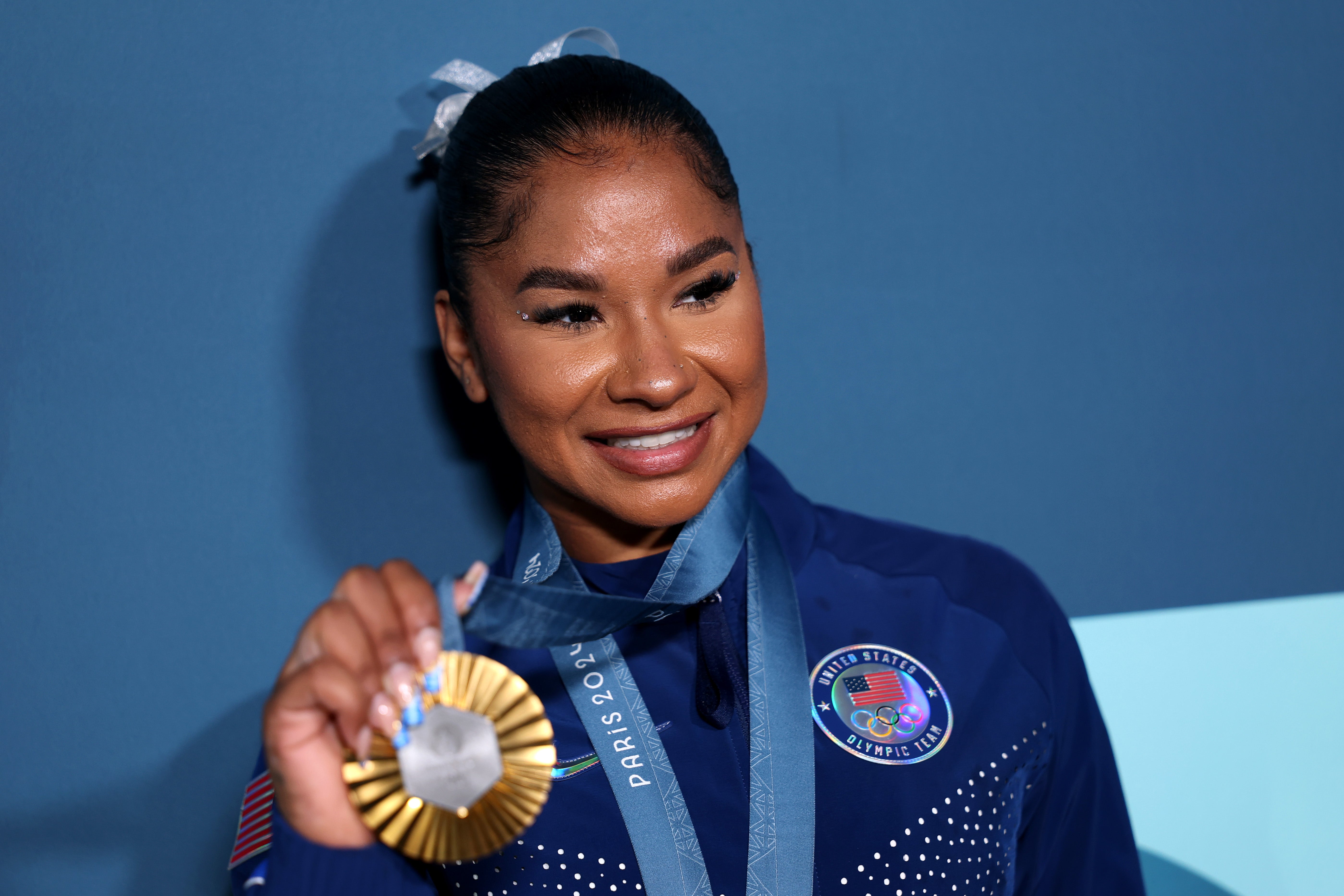 Chiles poses with her Paris 2024 Olympic medals following the Artistic Gymnastics Women's Floor Exercise Final on day ten of the Olympic Games Paris 2024 that has now caused weeks of controversy in the gymnastics world