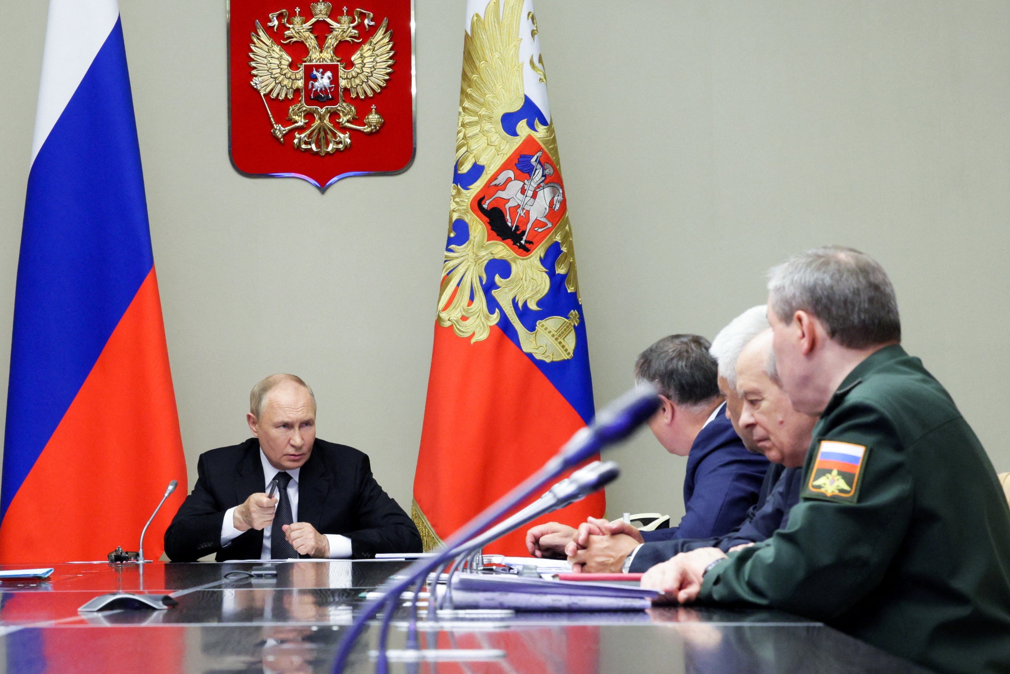 Russia’s President Vladimir Putin chairs a meeting with security officials to discuss Kursk