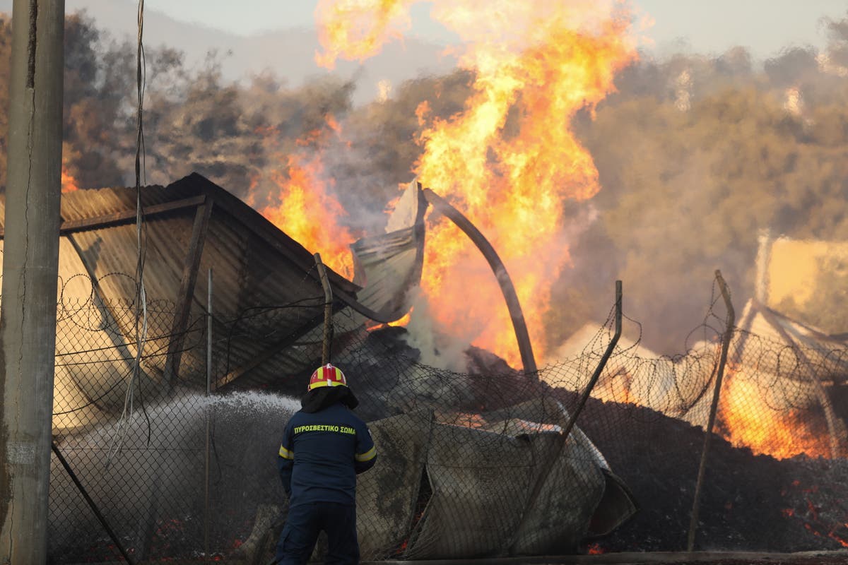 Greek firefighters to battle through the night as flames threaten Athens