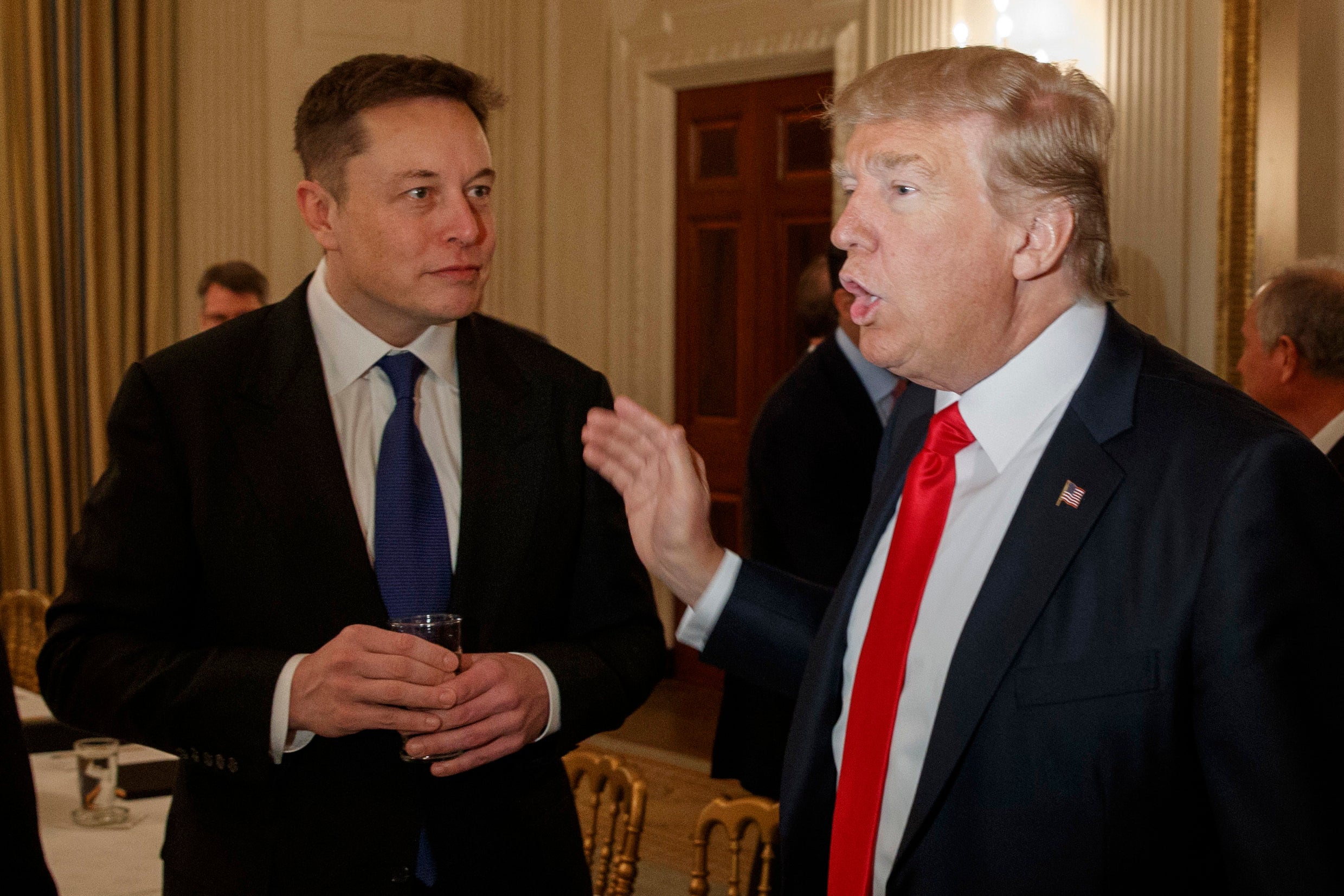 Donald Trump speaks with Elon Musk at the White House in 2017