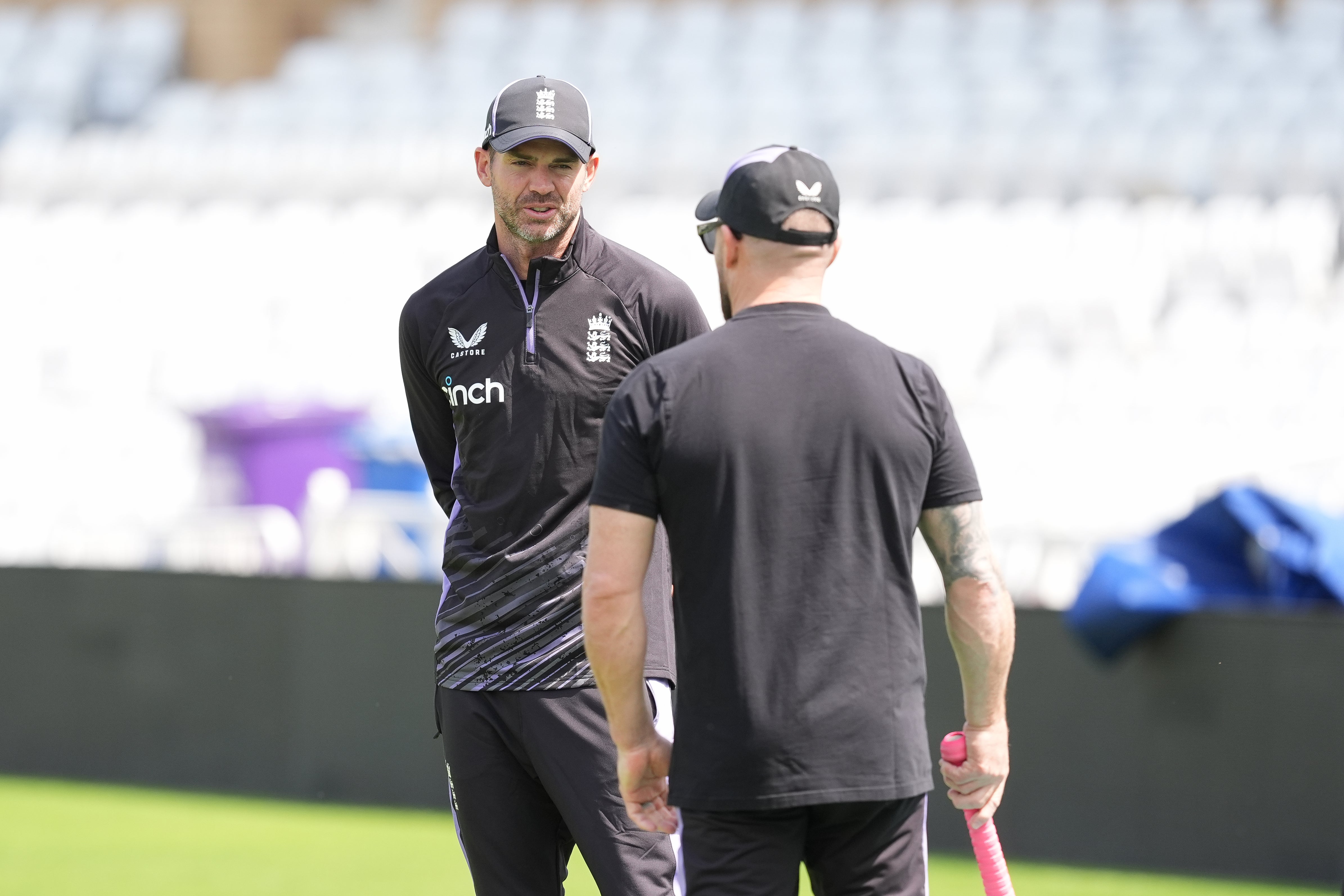 James Anderson, left, with England head coach Brendon McCullum (Martin Rickett/PA)