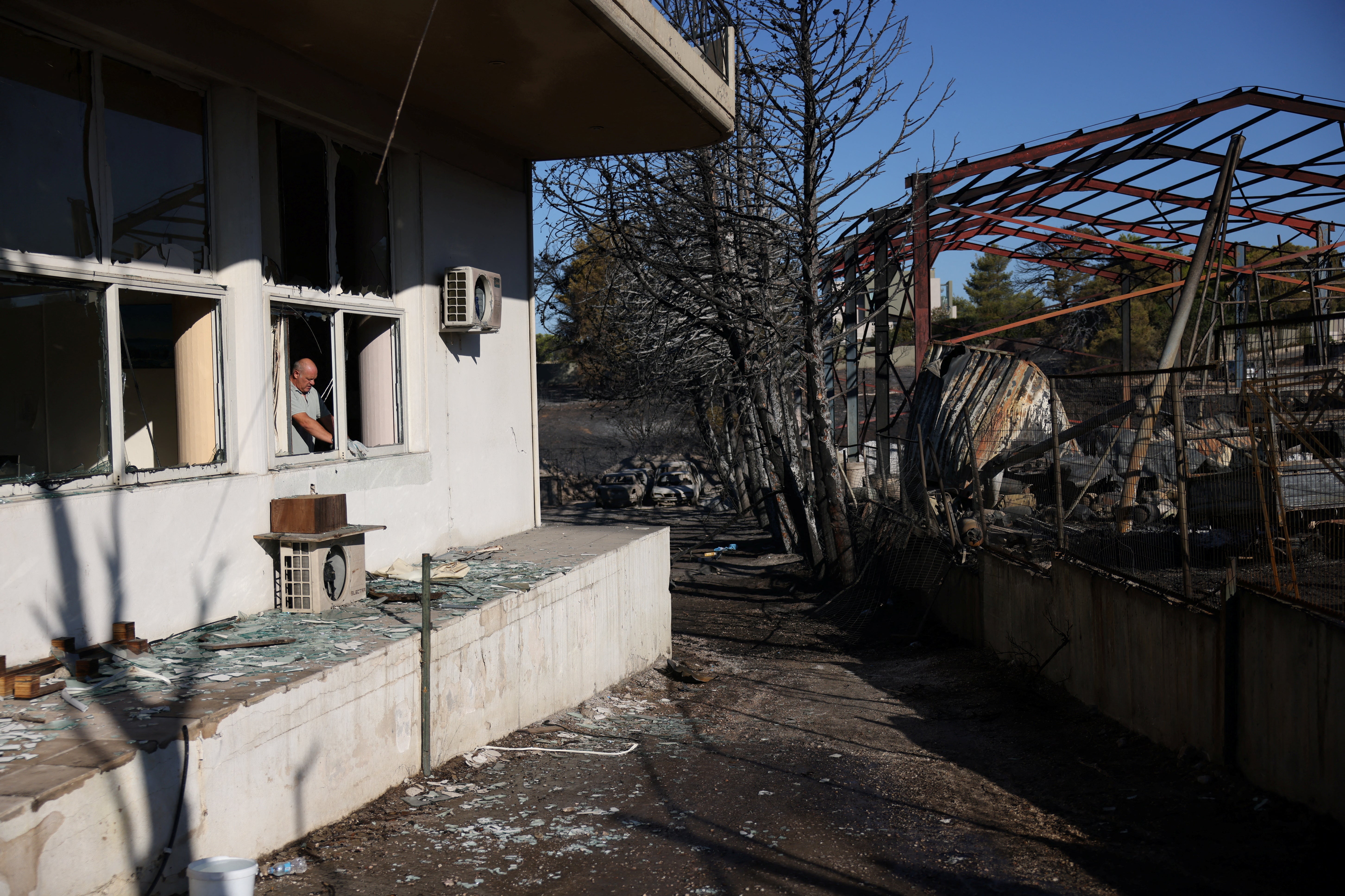 A view of a damaged factory following a wildfire in the Penteli area near Athens, Greece