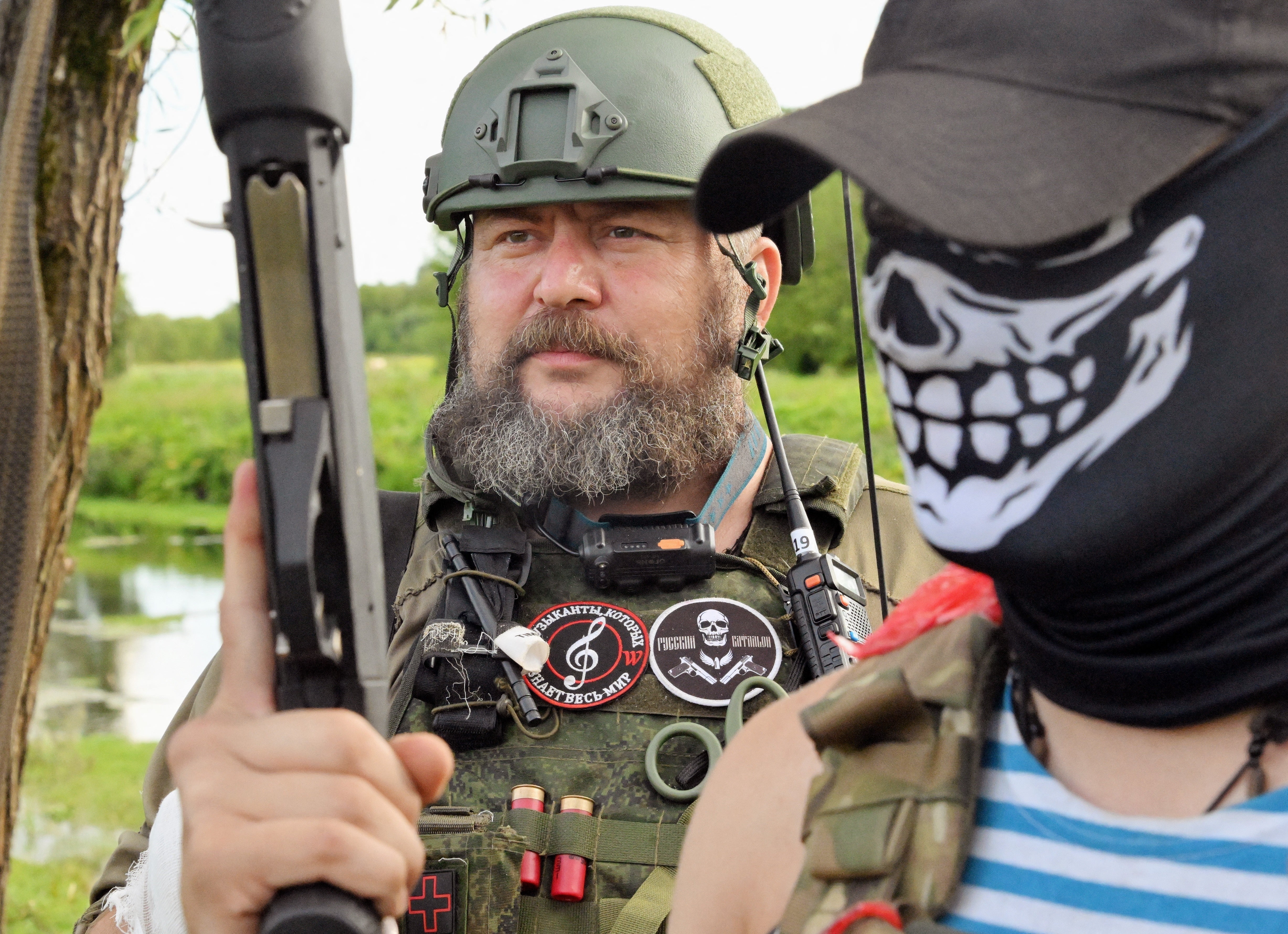 Local Russian militia fighters stand at an undisclosed location in the Kursk region