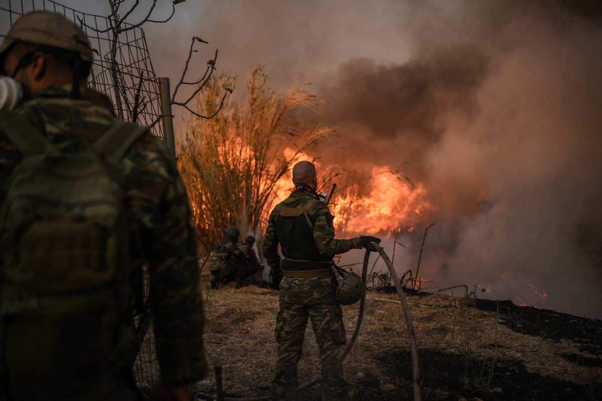 Greece fires: One dead, strong winds to spread fire as Athens seaside town evacuated