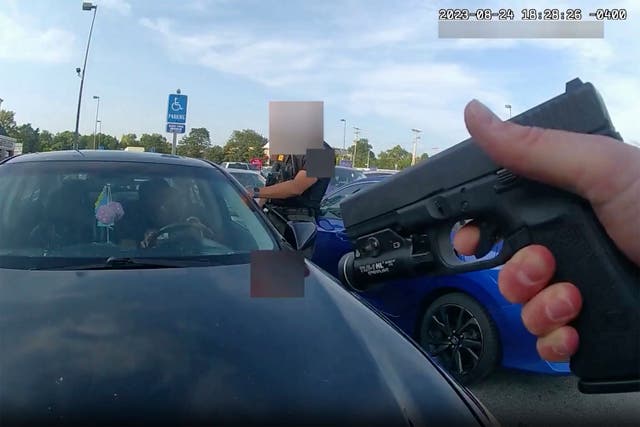 <p>Bodycam video shows an officer pointing his gun at Ta’Kiya Young moments before shooting her through the windshield outside a grocery store in Blendon Township, Ohio, a suburb of Columbus</p>