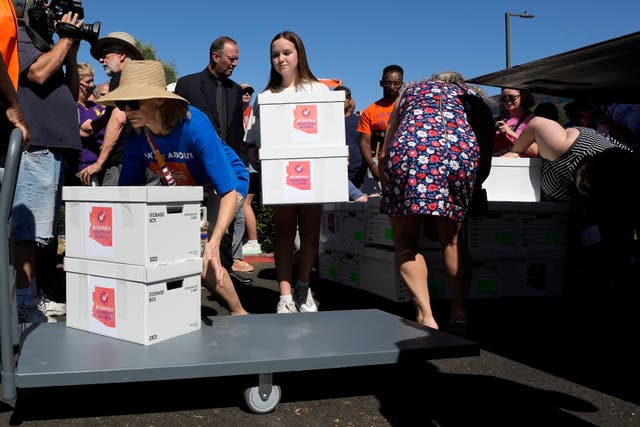<p>Arizona abortion-rights supporters deliver over 800,000 petition signatures to the Capitol to get an amendment enshrining abortion rights on the ballot</p>