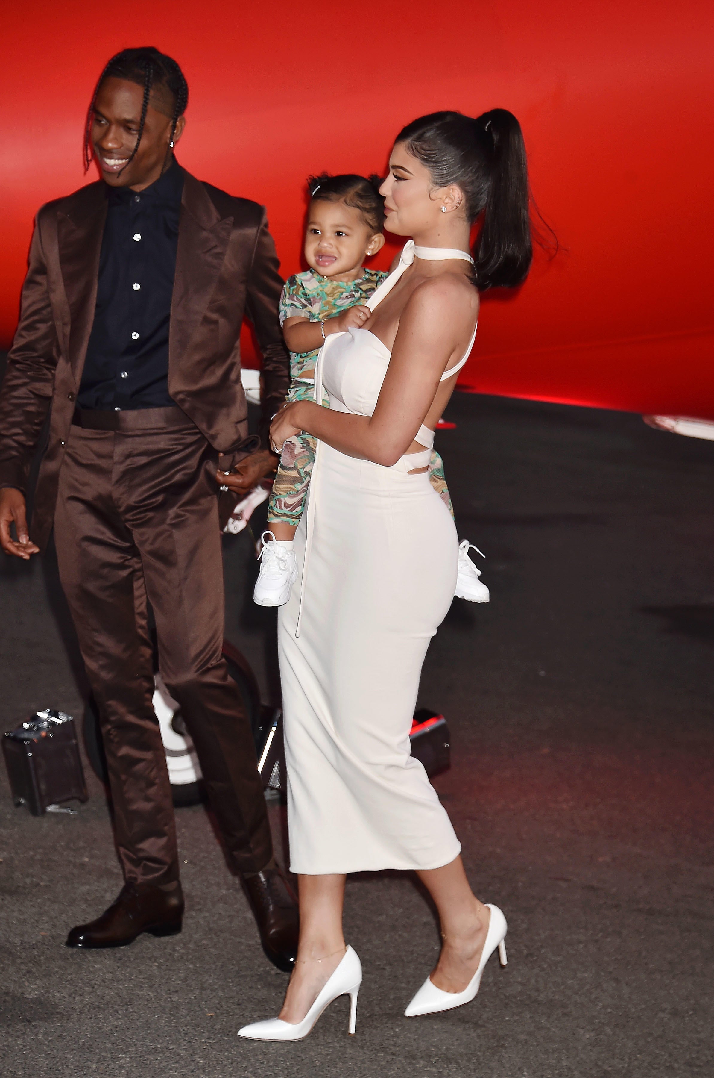 Travis Scott, Stormi Webster and Kylie Jenner attend the Travis Scott: Look Mom I Can Fly Los Angeles premiere at The Barker Hanger in 2019 (Jeffrey Mayer/Alamy/PA)