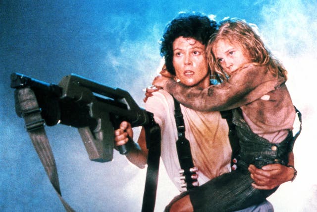 <p>‘Get away from her you b****!’: Sigourney Weaver and Carrie Henn in ‘Aliens’ </p>