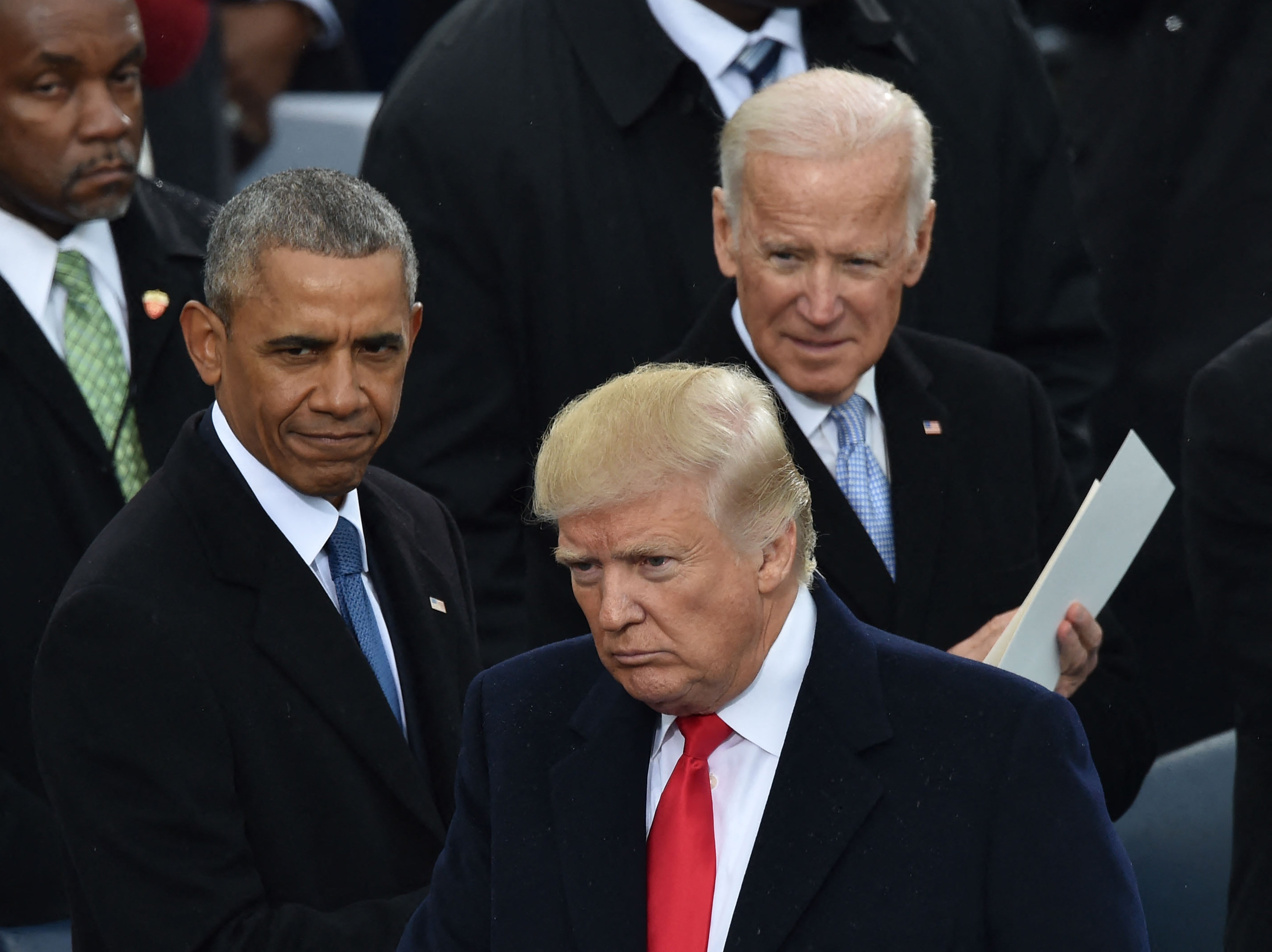 Obama and Biden look on during Trump’s first inauguration in January 2017