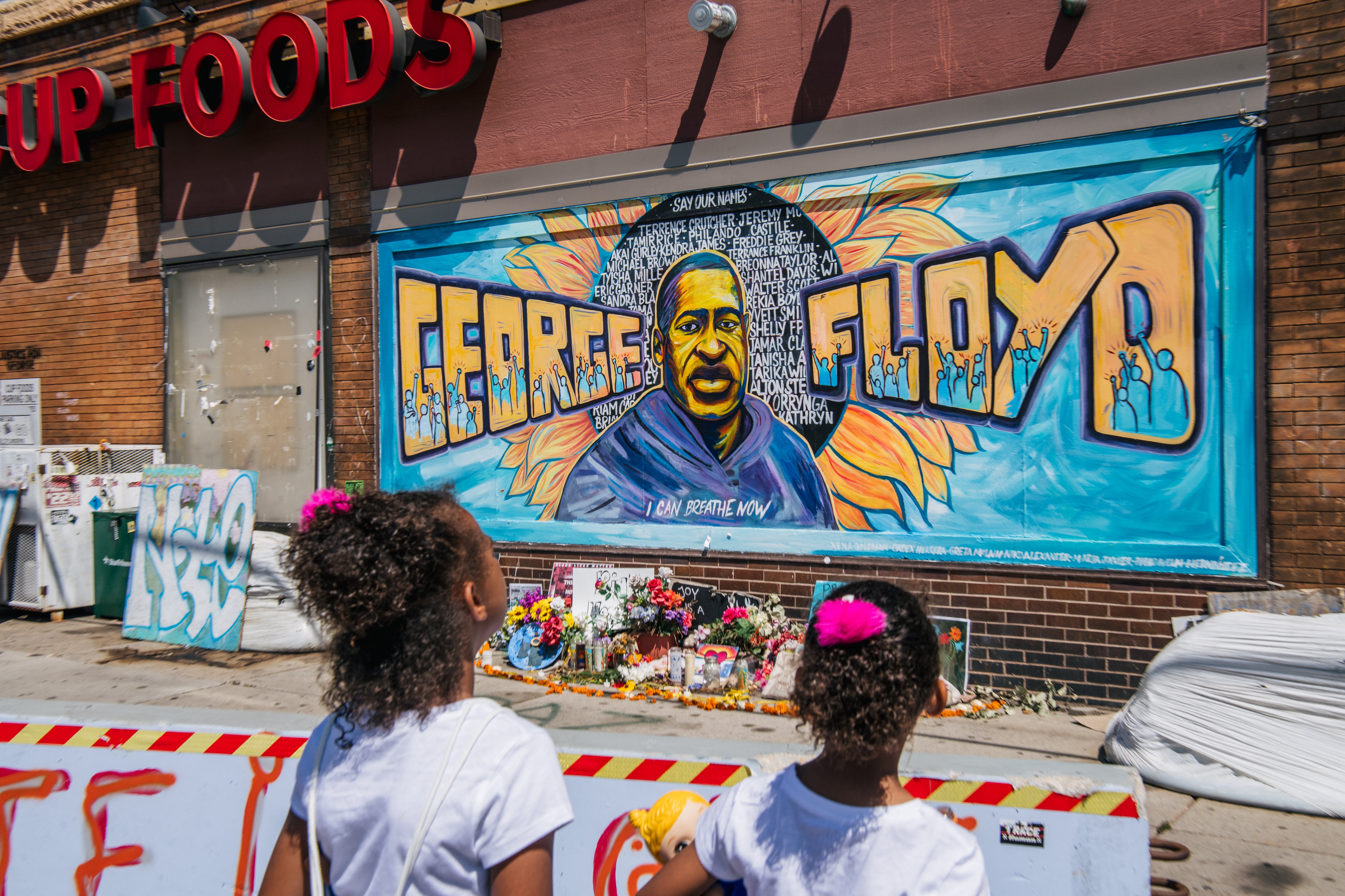 Jordan and Royal Pacheco learn of George Floyd's murder at the intersection of 38th Street and Chicago Avenue, ahead of former Minneapolis police officer Derek Chauvin's sentencing, on June 25, 2021 in Minneapolis, Minnesota