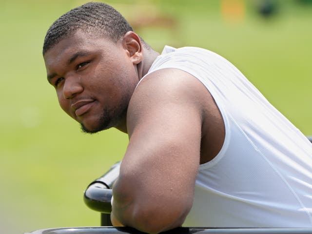 <p>Cleveland Browns defensive tackle Mike Hall Jr. waits for his turn to speak at a news conference during an NFL football training camp practice Saturday, July 27, 2024, in White Sulphur Springs, West Virginia. Hall was arrested on August 13, 2024 and charged with domestic violence after he allegedly threatened his fiancé with a gun during an argument</p>