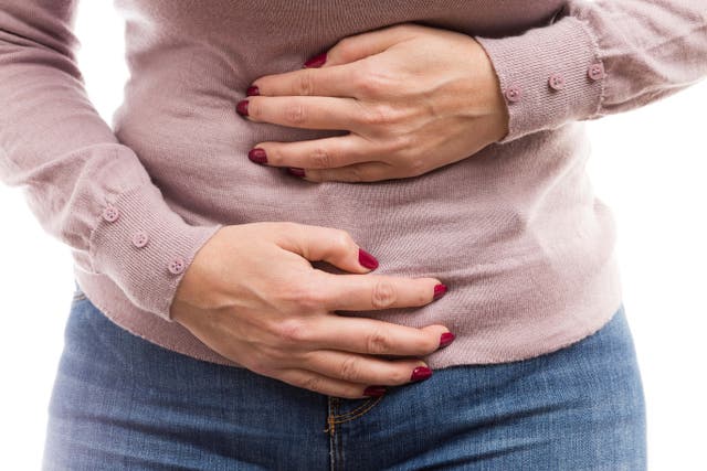 Women who have symptoms such as bloating, bowel changes, appetite changes, or abdominal pain should be prioritised for a blood test and ultrasound under guidelines (Alamy/PA)