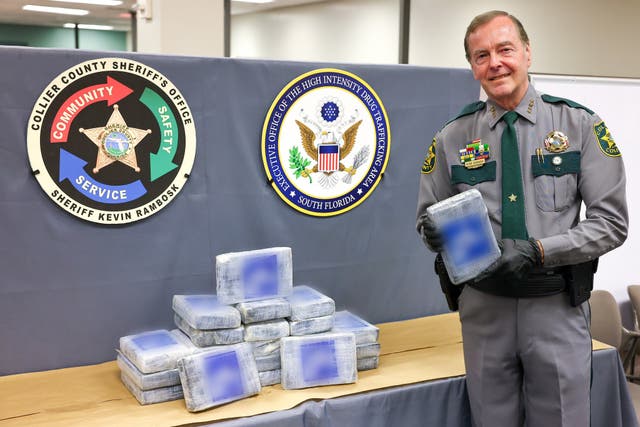 <p>A officer from the Collier County Sheriff’s Office holds up a package of drugs found floating in the Gulf of Mexico on August 12, 2024</p>