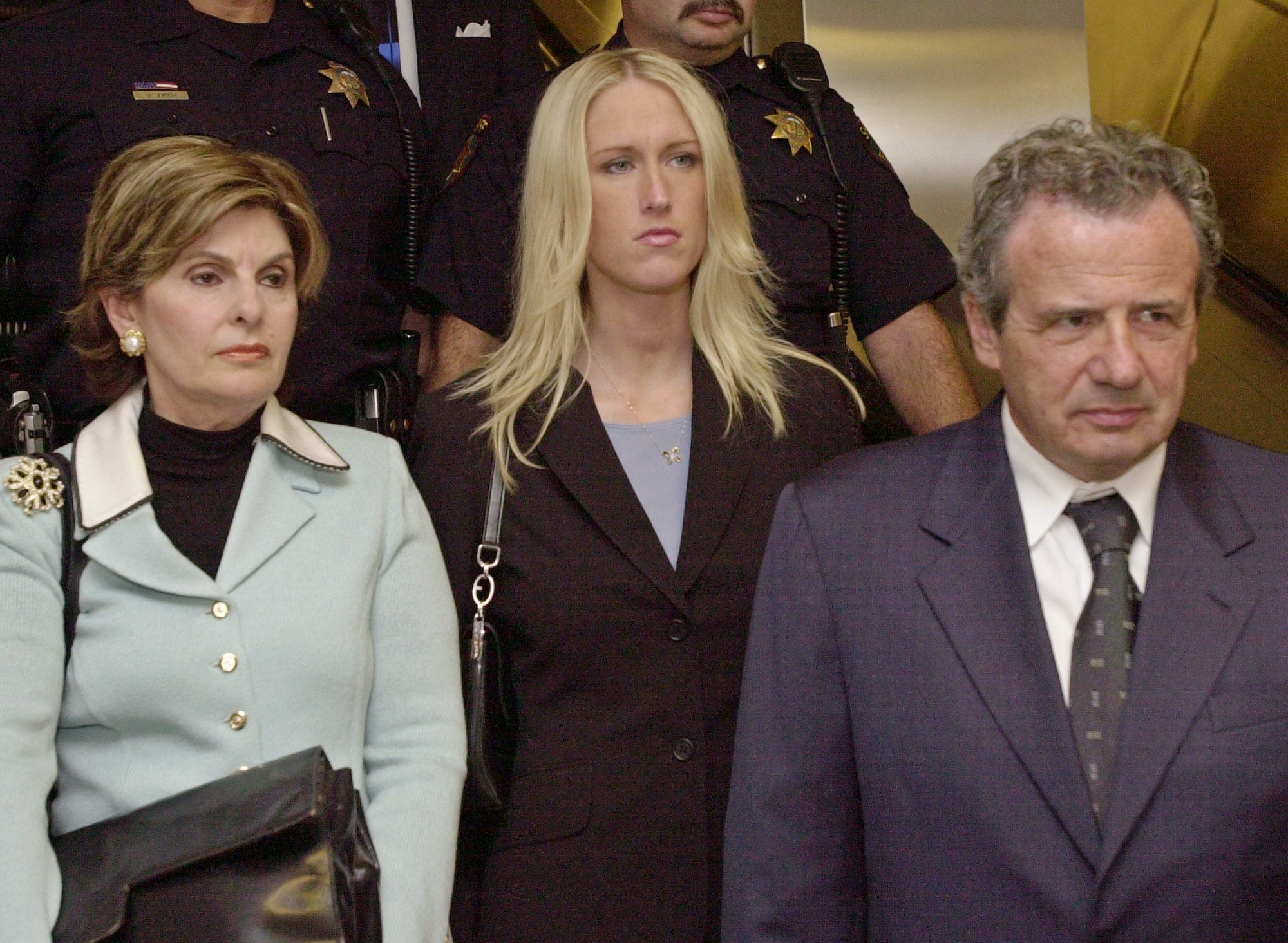 Amber Frey (center) leaves court after testing in Peterson's murder trial