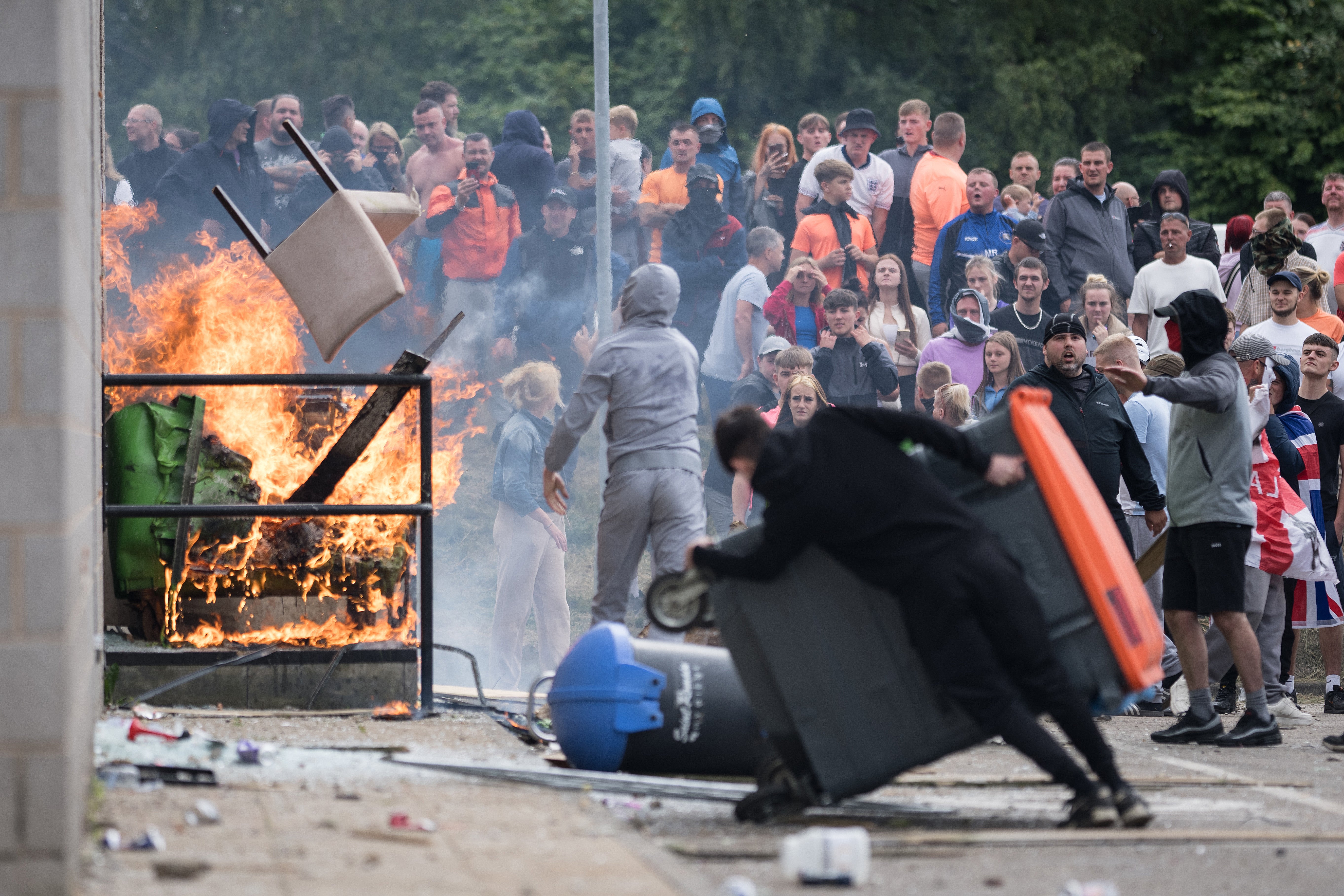 Anti-migration protesters try to go into Holiday Inn Express Hotel housing asylum seekers on 4 August in Rotherham