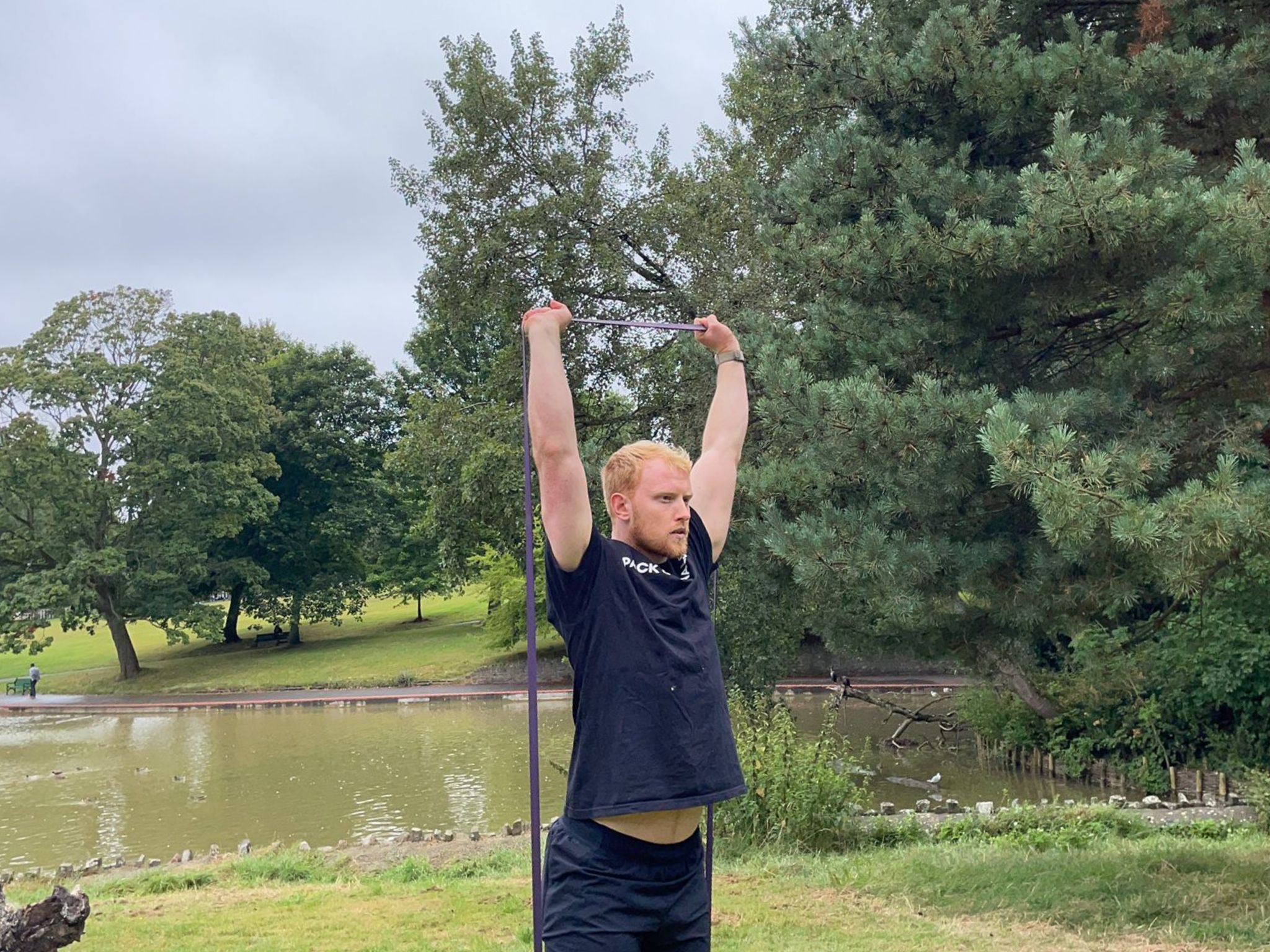 Harry Bullmore performing a banded overhead press