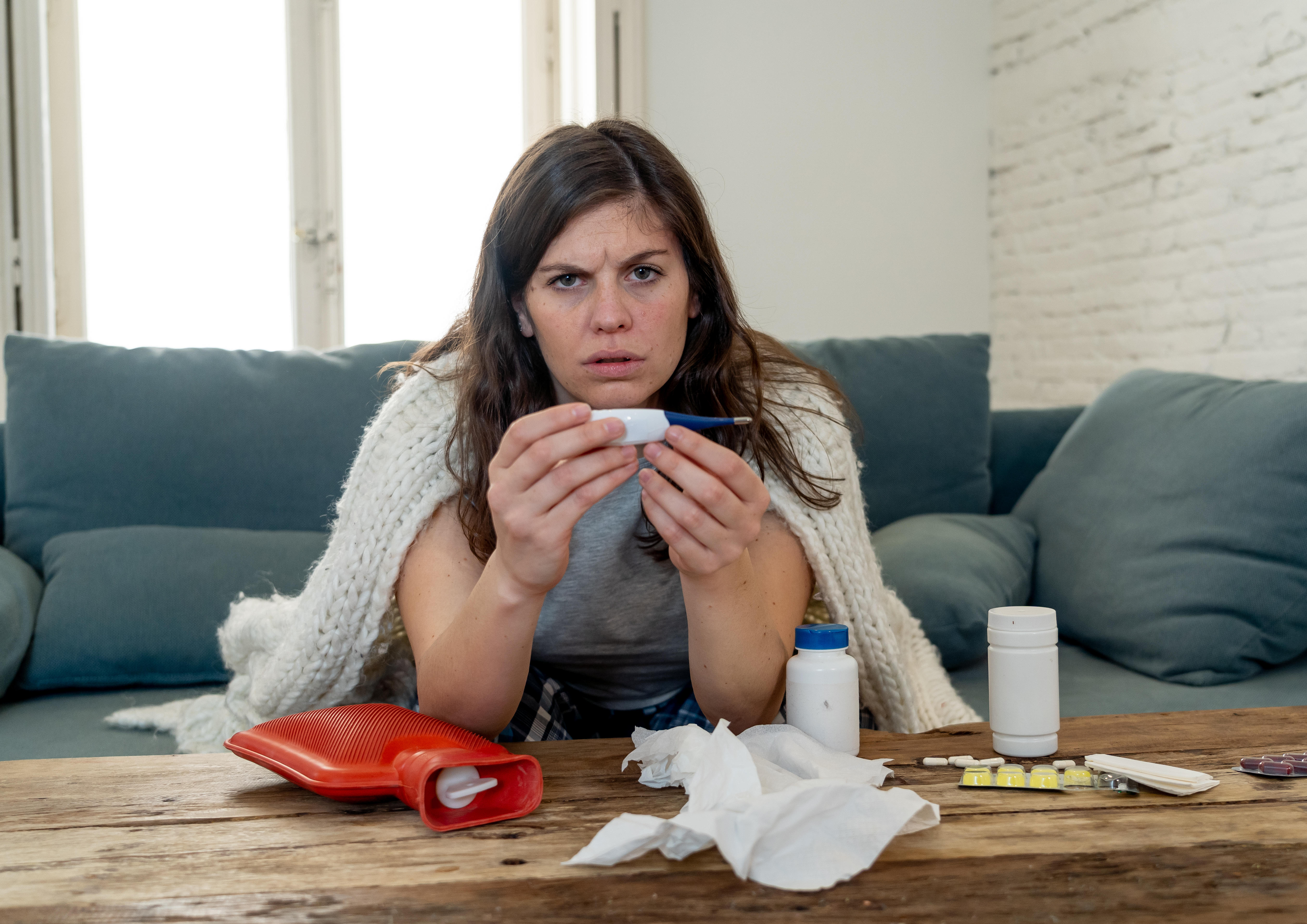 The affected person may experience symptoms of fever (Alamy/PA)