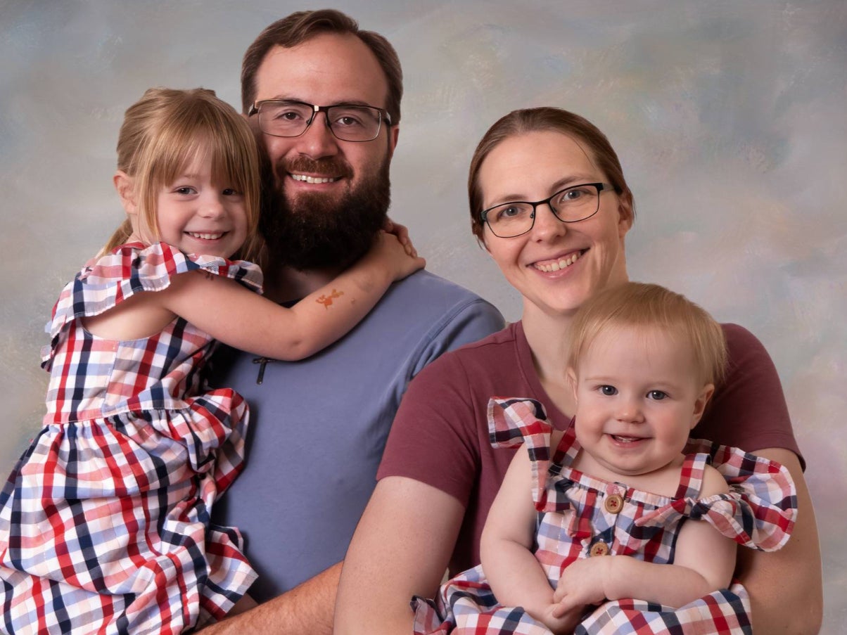 Nathan Morris, 35, with his wife and children