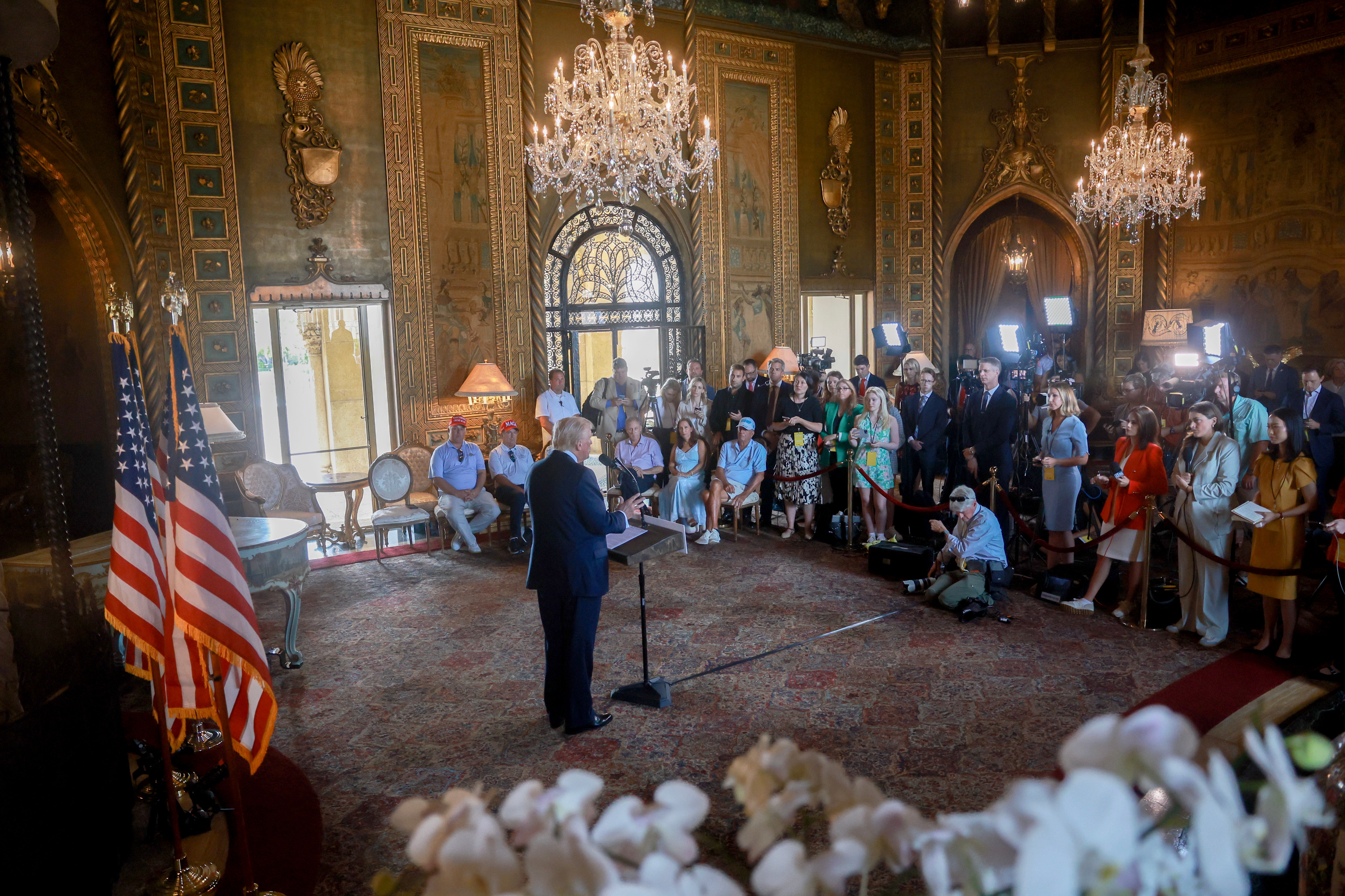 Donald Trump speaks to reporters inside Mar-a-Lago on August 8.