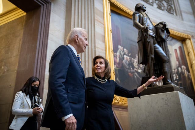 <p>Joe Biden and Speaker of the  Nancy Pelosi walk through the Rotunda on March 29, 2022 in Washington, DC. </p>