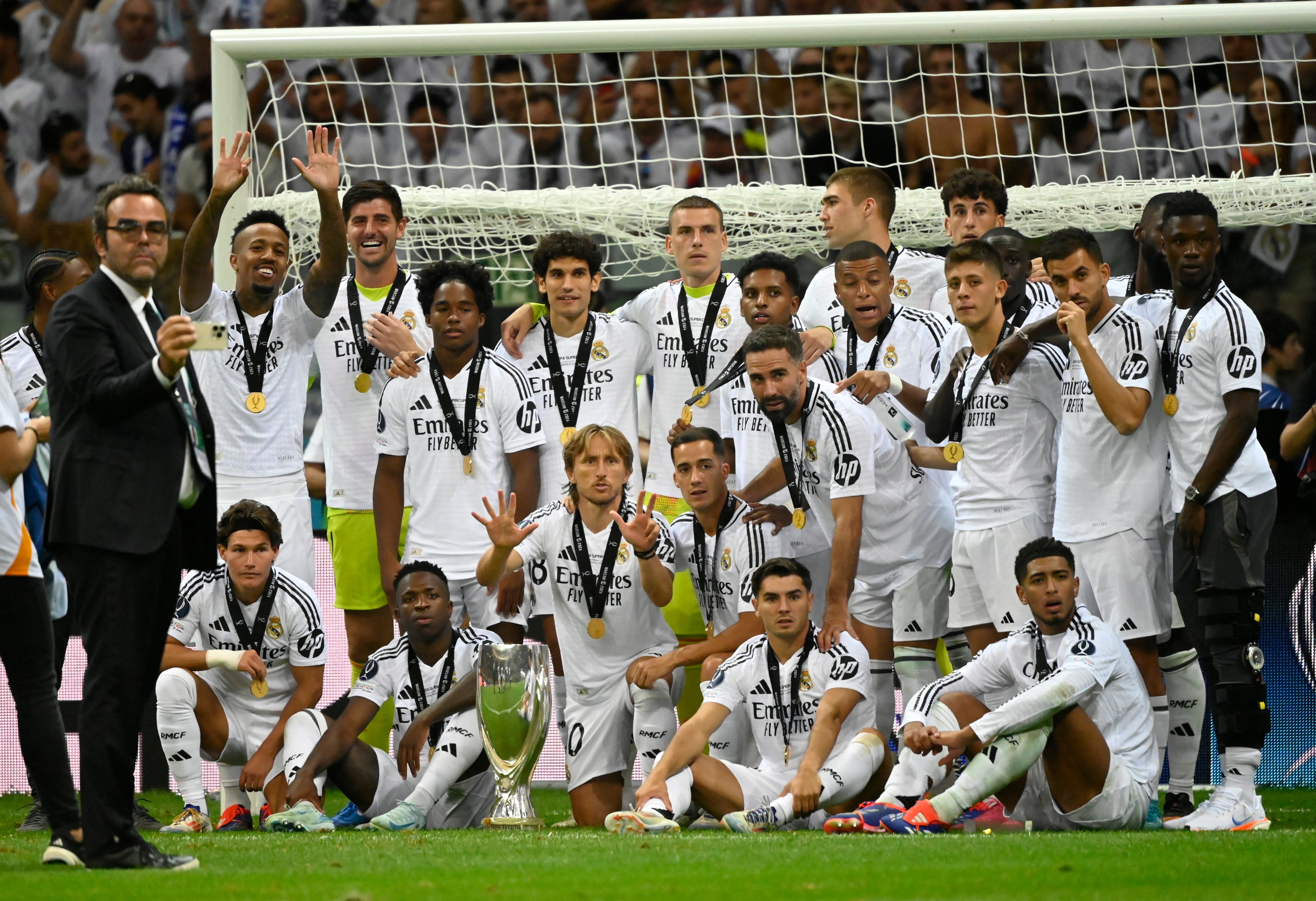 Real Madrid's players celebrate with the trophy