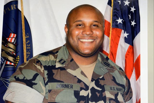 <p>A picture provided by Los Angeles Police Department of alleged suspect Christopher Dorner is displayed during briefing on February 7, 2013 in Los Angeles, California</p>