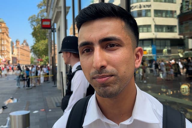 Security guard Abdullah, 29, who works at TWG Tea shop at the scene in Leicester Square, London (Eleanor Cunningham/PA)