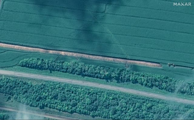 <p>This image released by Maxar Technologies shows a trench being built southeast of Lgov, west of Kursk</p>