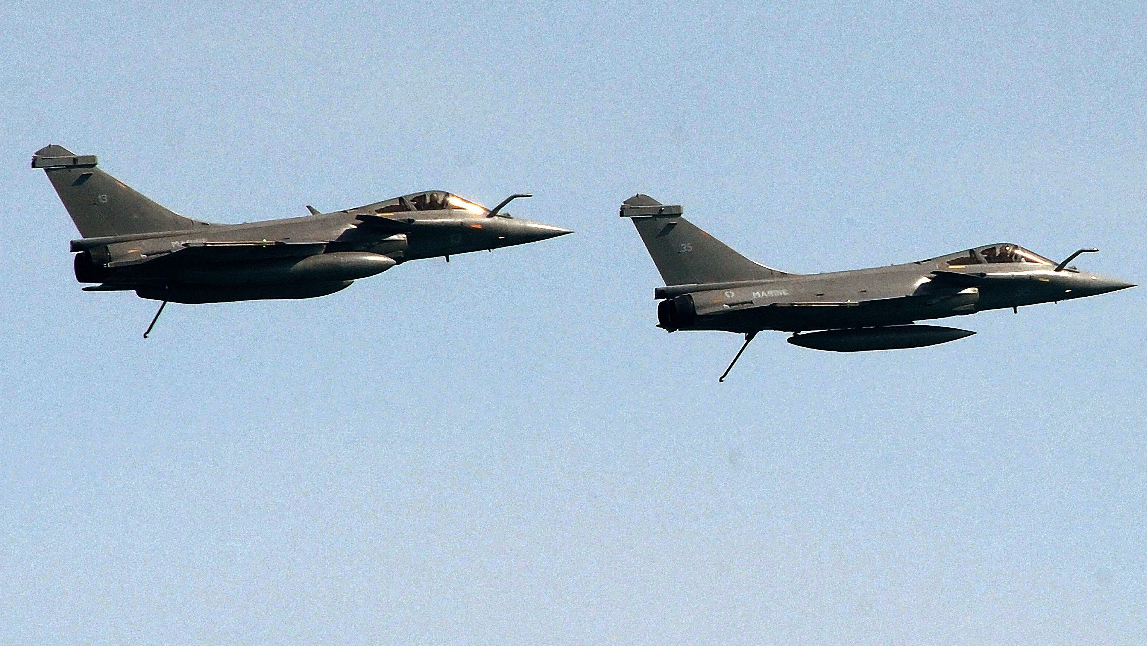 File: Two French Rafales jet fighters fly during an international military exercise with Indian navy on 11 May 2017