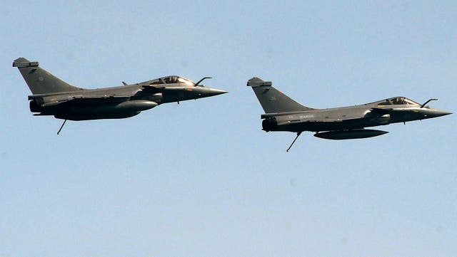 <p>File: Two French Rafales jet fighters fly during an international military exercise with Indian navy on 11 May 2017</p>