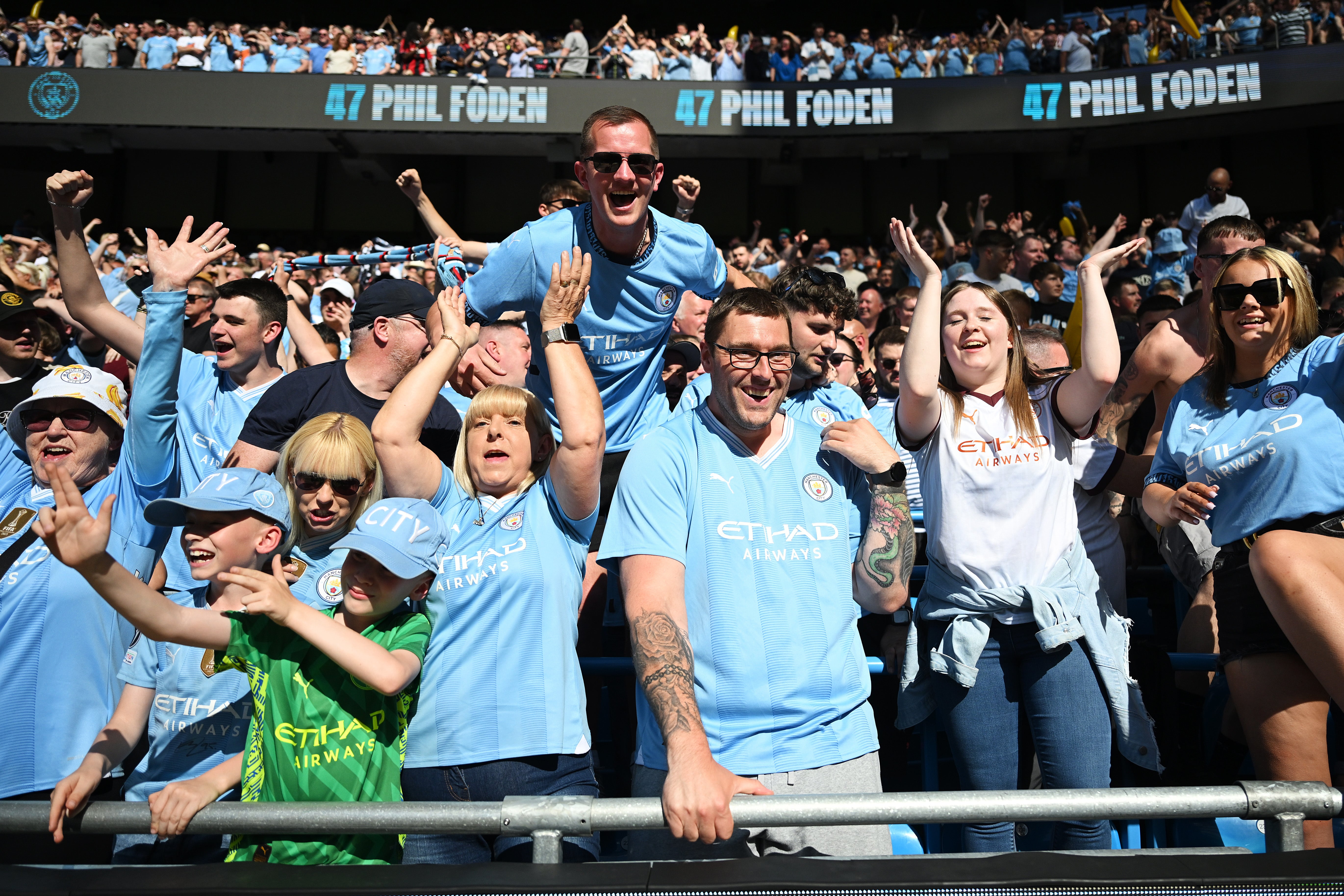 Fans of Manchester City celebrate