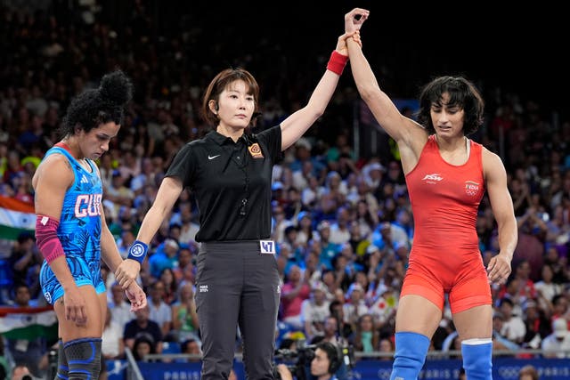 <p>India’s Vinesh Phogat, right, celebrates after defeating Cuba’s Yusneylys Guzman during their women’s freestyle 50kg wrestling semi-final match at the Paris Olympics </p>