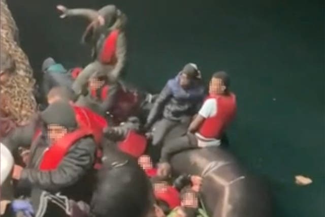 <p>Migrants being rescued from a sinking boat on 14 December 2022 </p>