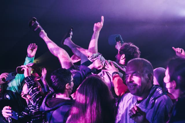 <p>A man crowd-surfs at End of the Road 2023</p>