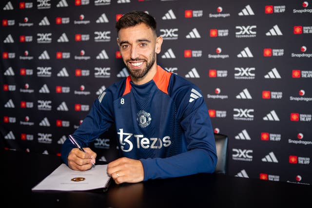 <p>Bruno Fernandes of Manchester United poses after signing a new deal</p>