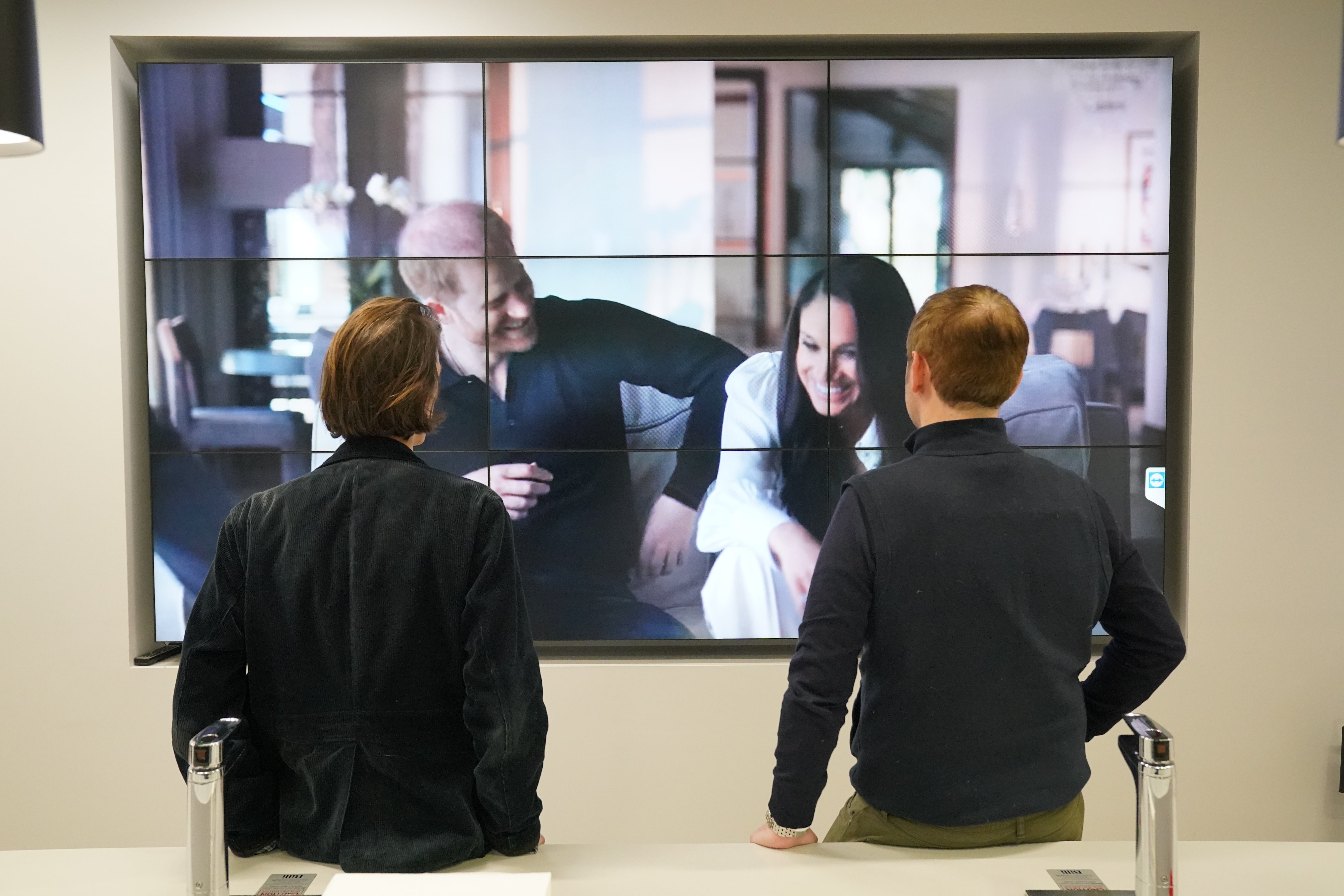 Office workers in London, watching the Duke and Duchess of Sussex’s Netflix documentary (Jonathan Brady/PA)