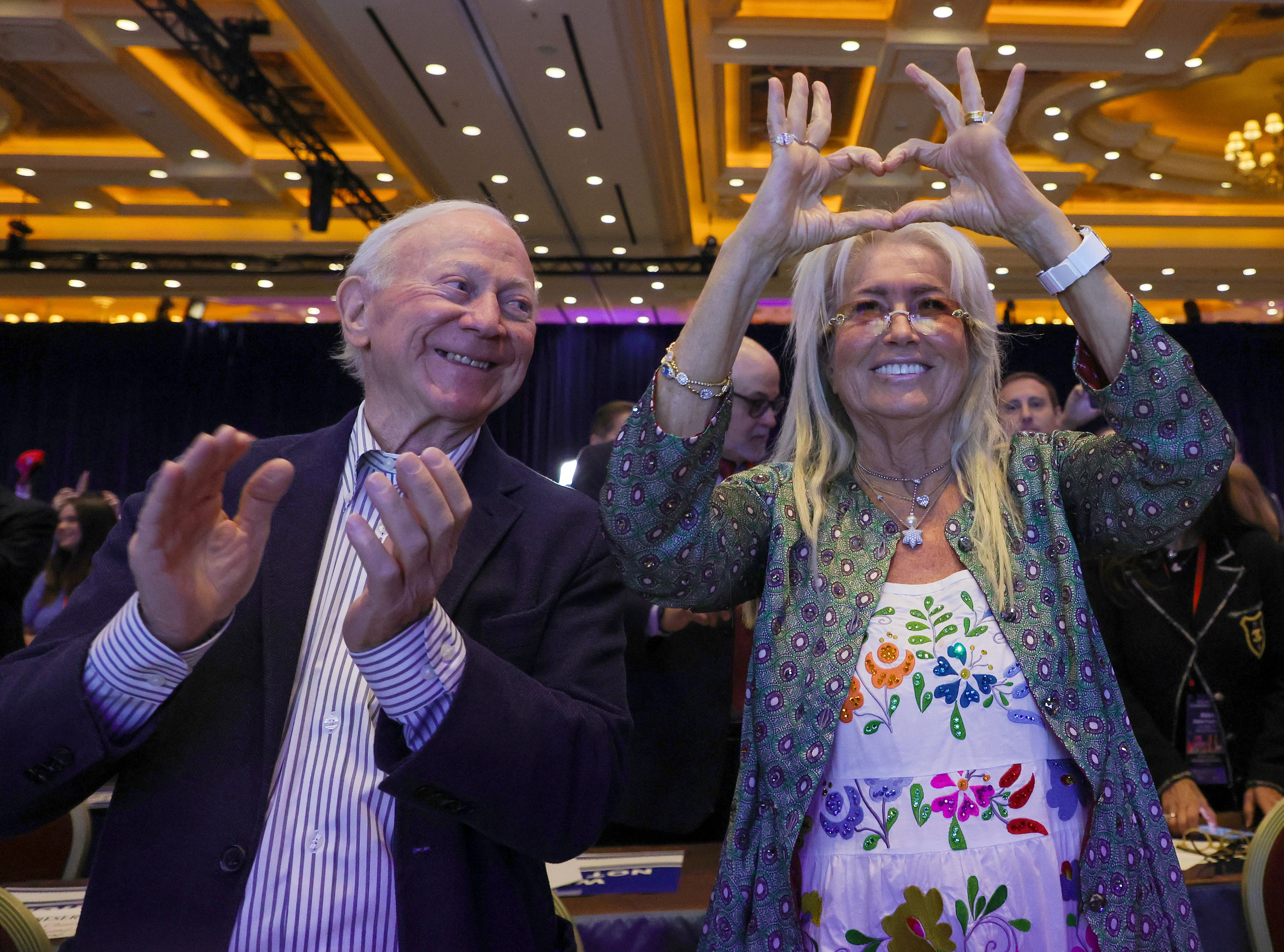 Miriam Adelson – with businessman Larry Mizel – makes a heart symbol as Donald Trump is introduced at the Republican Jewish Coalition’s Annual Leadership Summit at The Venetian Resort Las Vegas on October 28, 2023