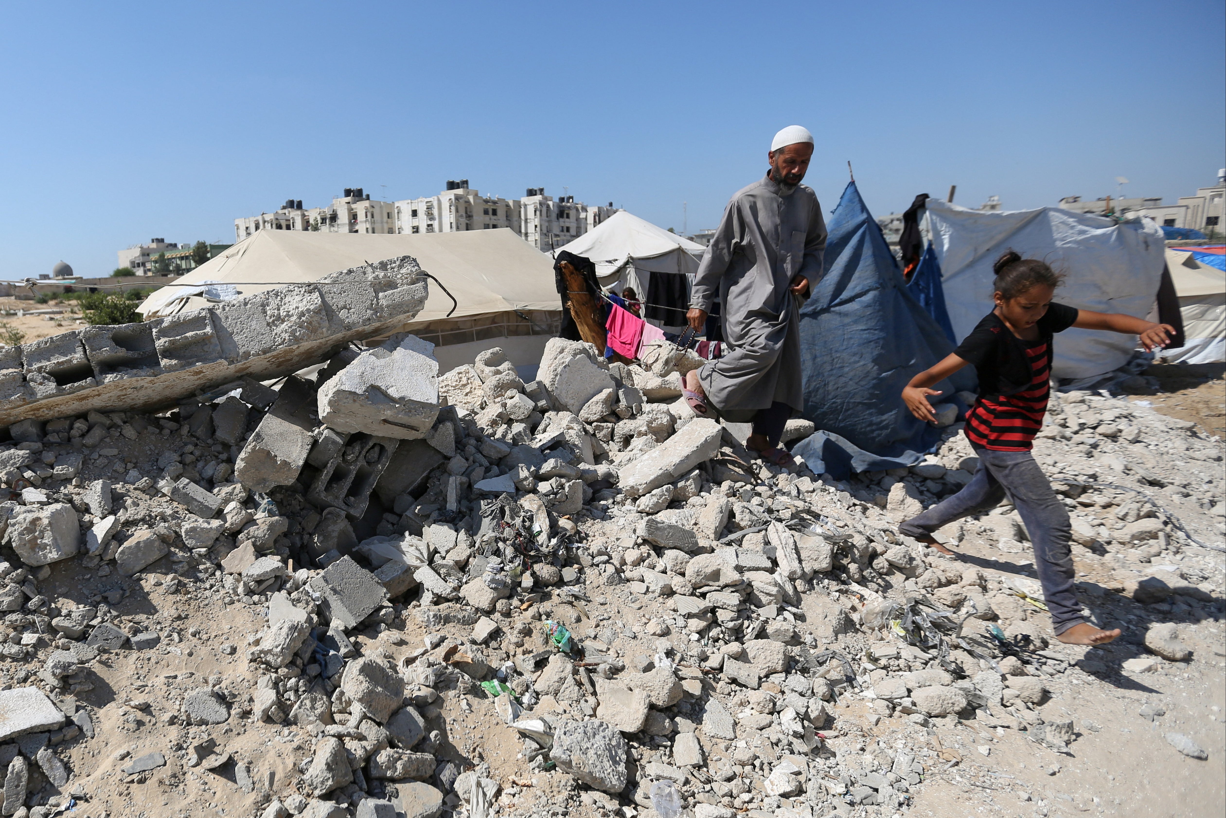 Displaced Palestinians shelter in a cemetery in Khan Younis in southern Gaza