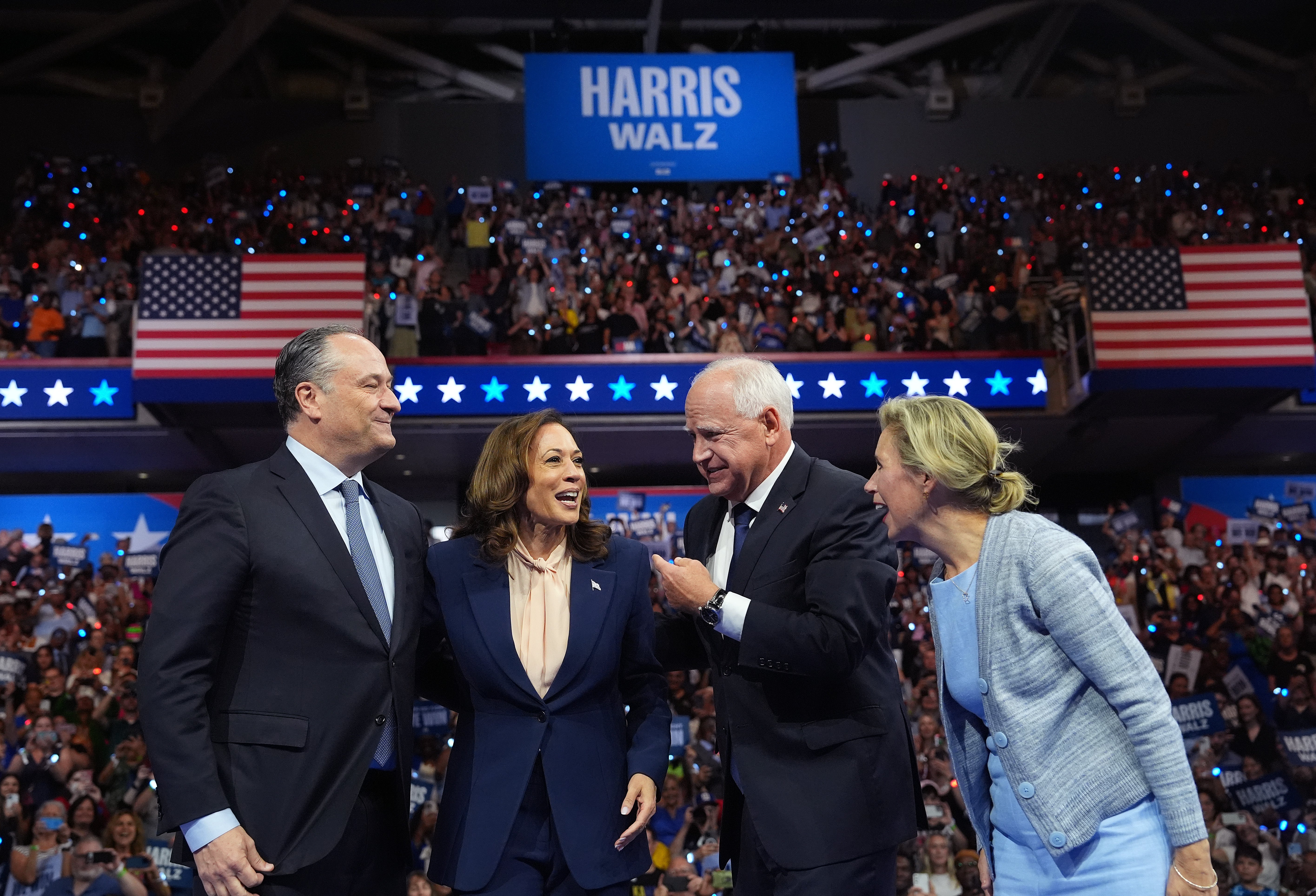 Who are they laughing at? Second gentleman Doug Emhoff, Democratic presidential candidate Kamala Harris, Democratic vice-presidential candidate Tim Walz, and his wife Gwen Walz