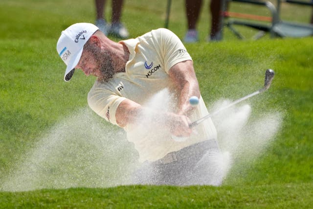 Chris Kirk hits from a bunker on the 18th hole (Mark Humphrey/AP)