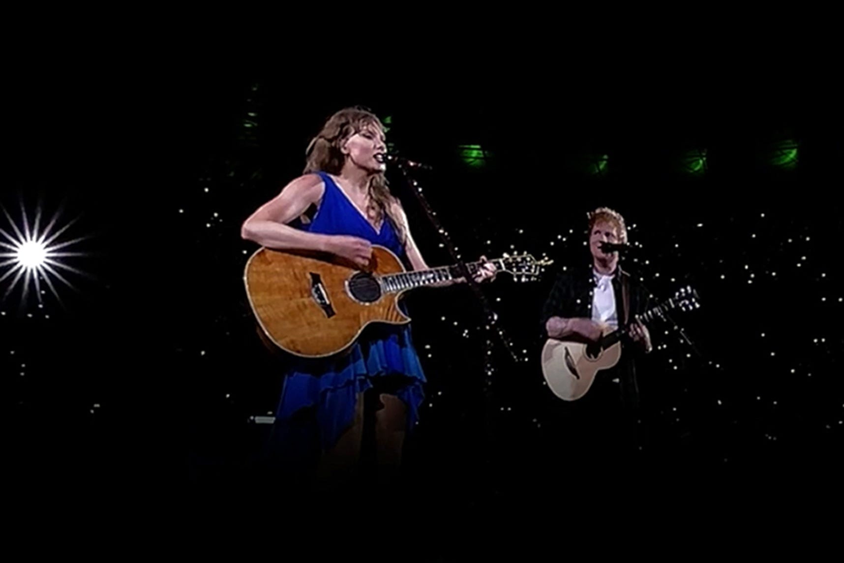 Taylor Swift performing on stage with surprise guest Ed Sheeran at Wembleya Stadium on 15 August