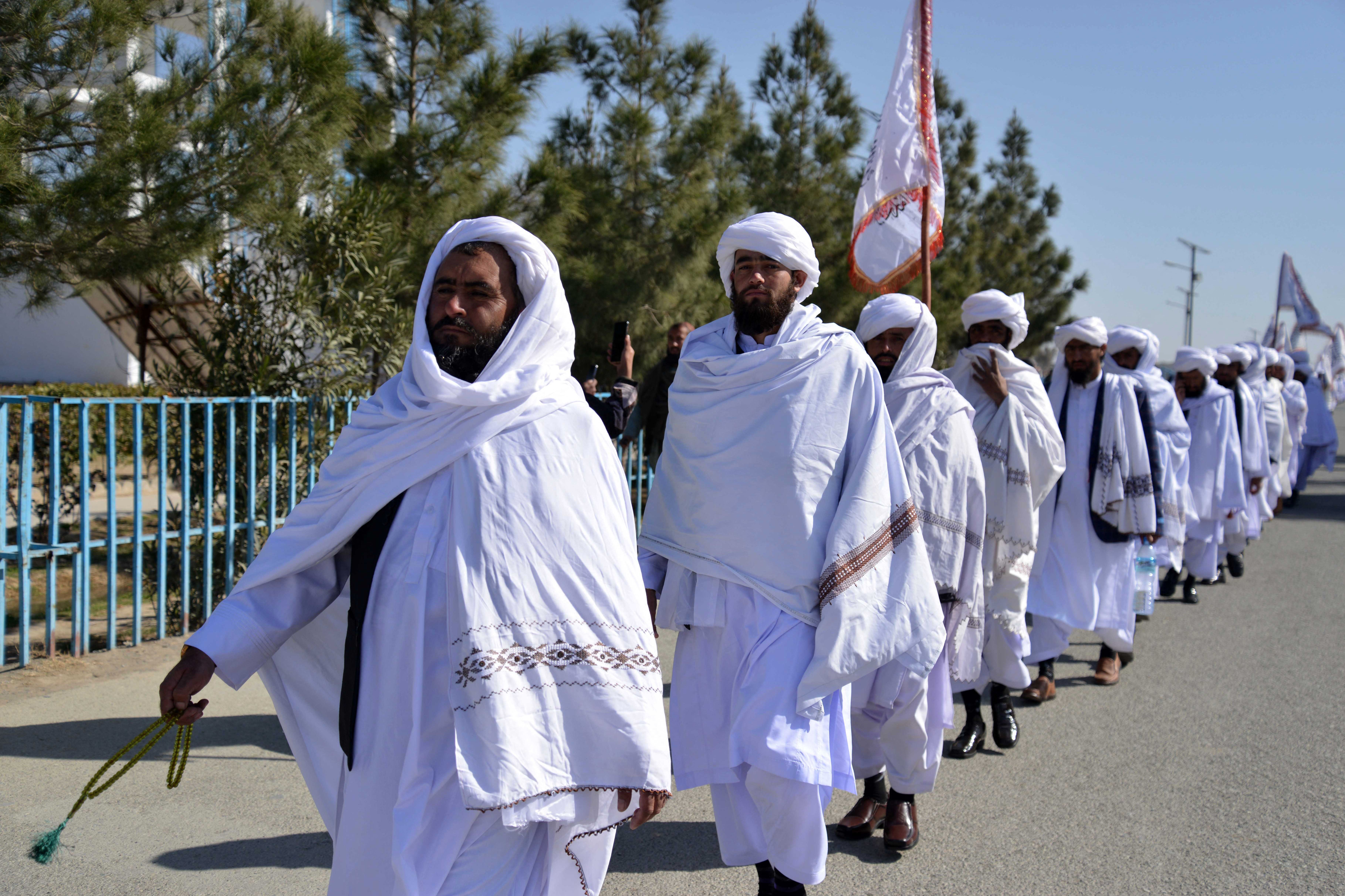 Taliban cleric students from a Madrasa arrive to attend their graduation ceremony in Kandahar