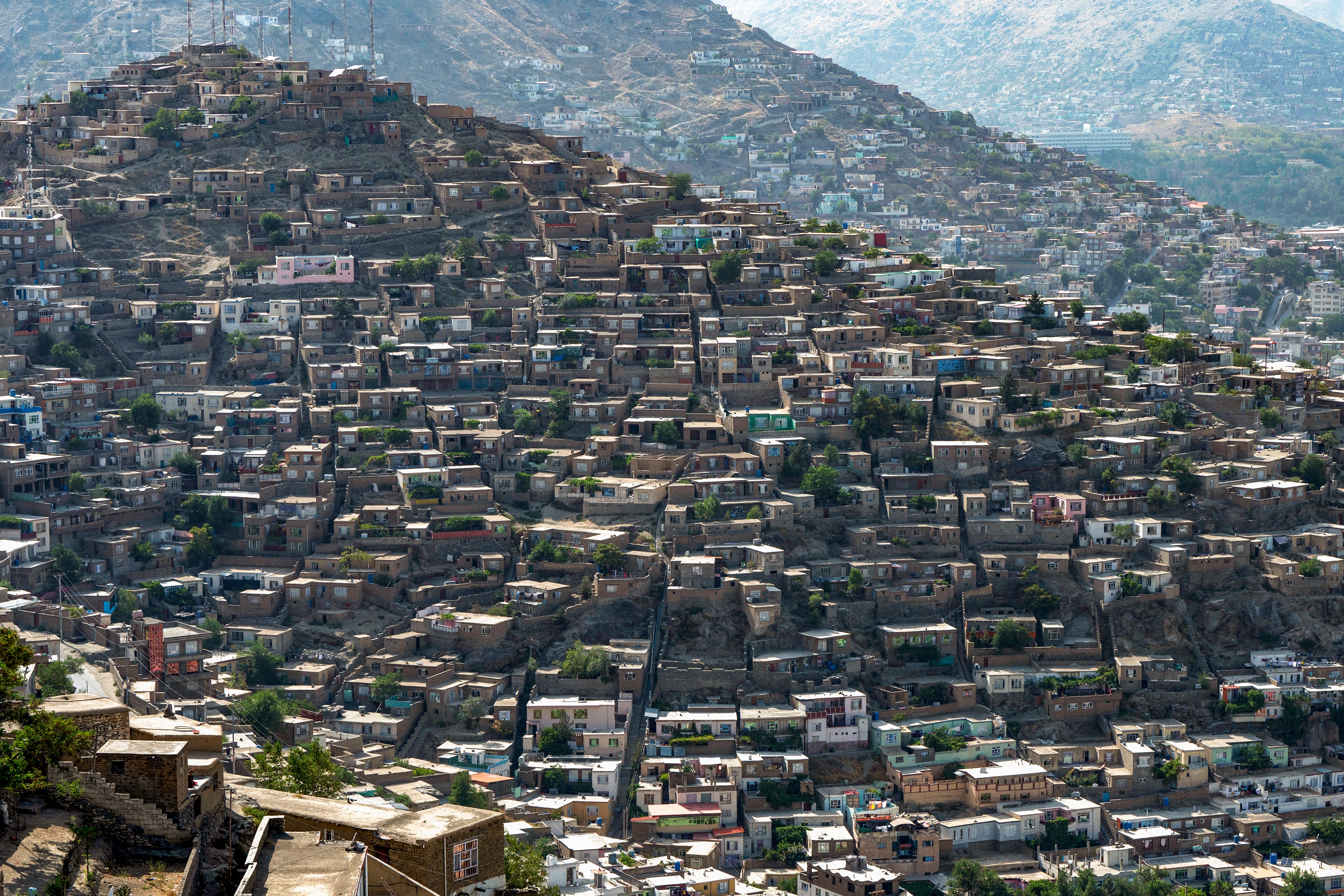 A general view shows residential houses on a hillside in Kabul