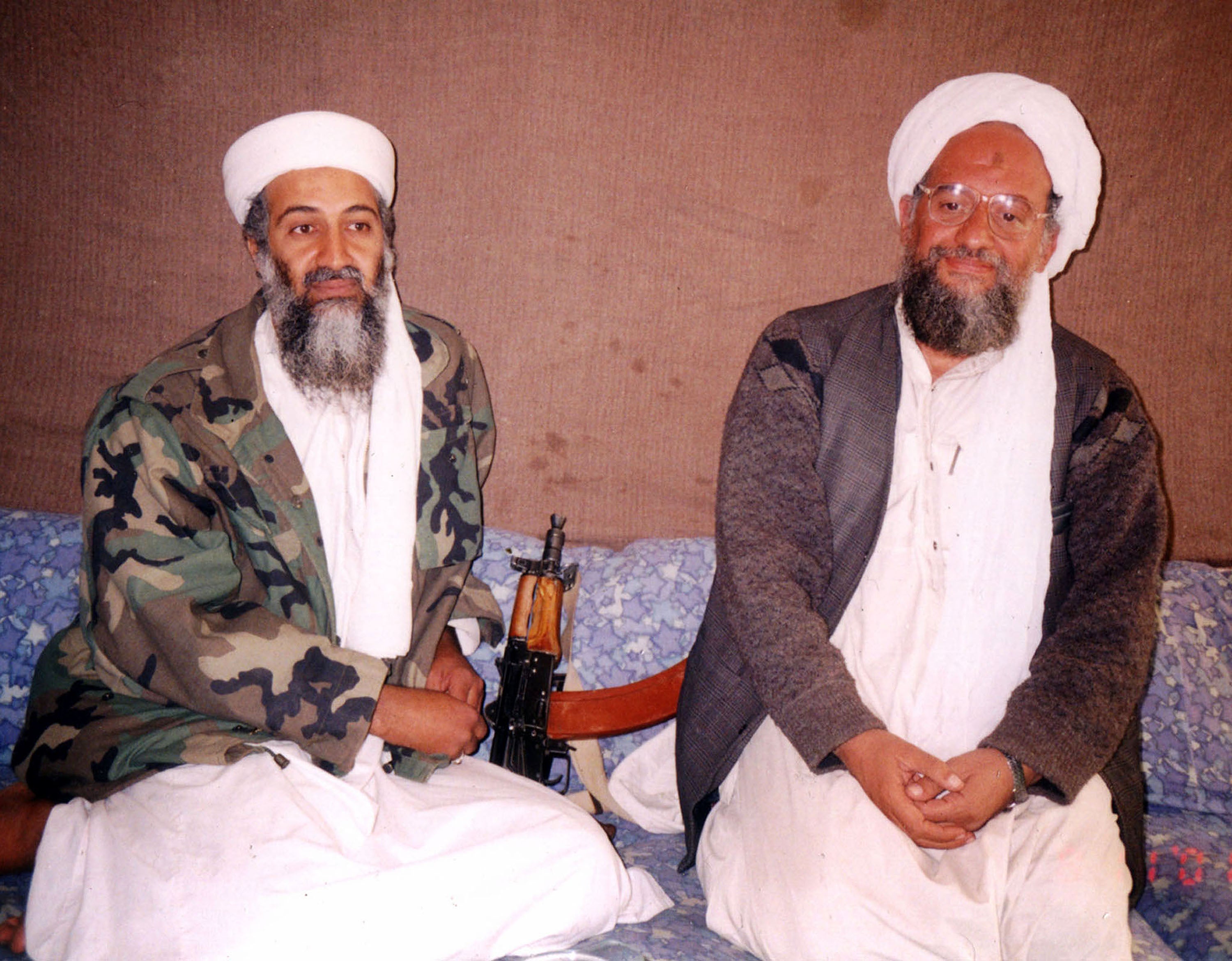 Osama bin Laden (L) sits with his adviser Ayman al-Zawahiri at an undisclosed location in Afghanistan